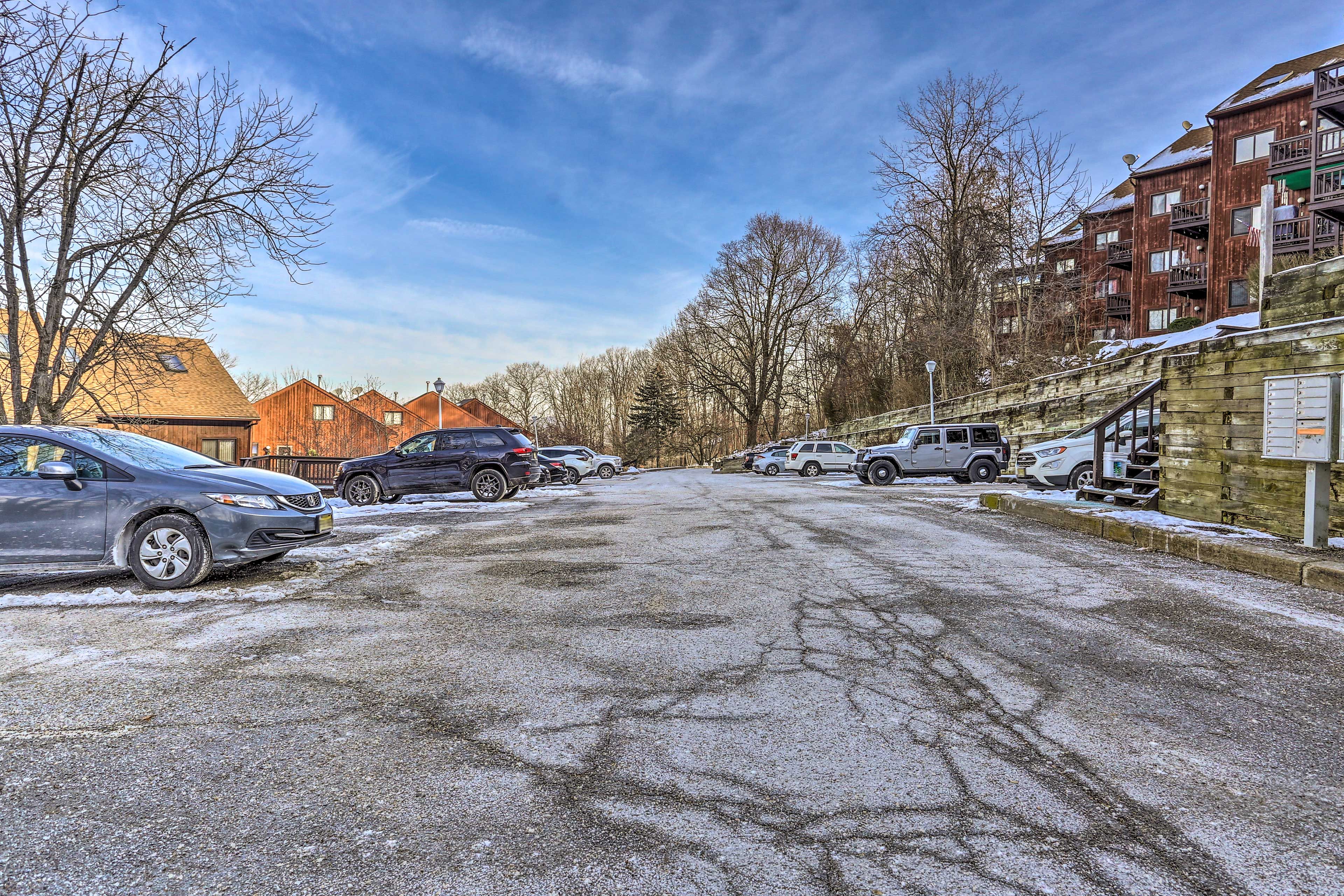 Property Exterior | Community Parking Lot (2 Vehicles, First-Come, First-Served)