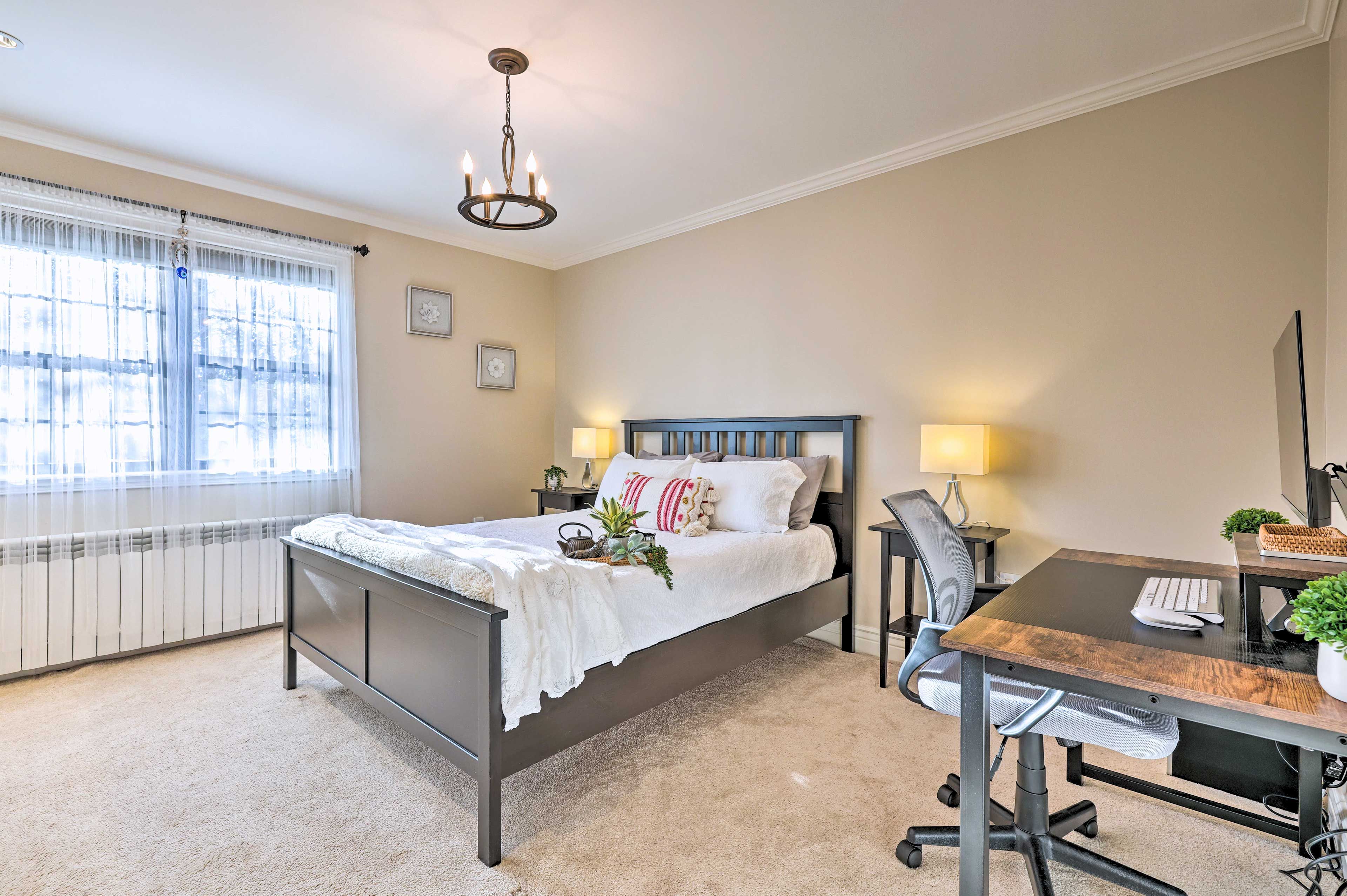 Bedroom 1 | Queen Bed | Work-Friendly Desk | Linens & Towels Provided