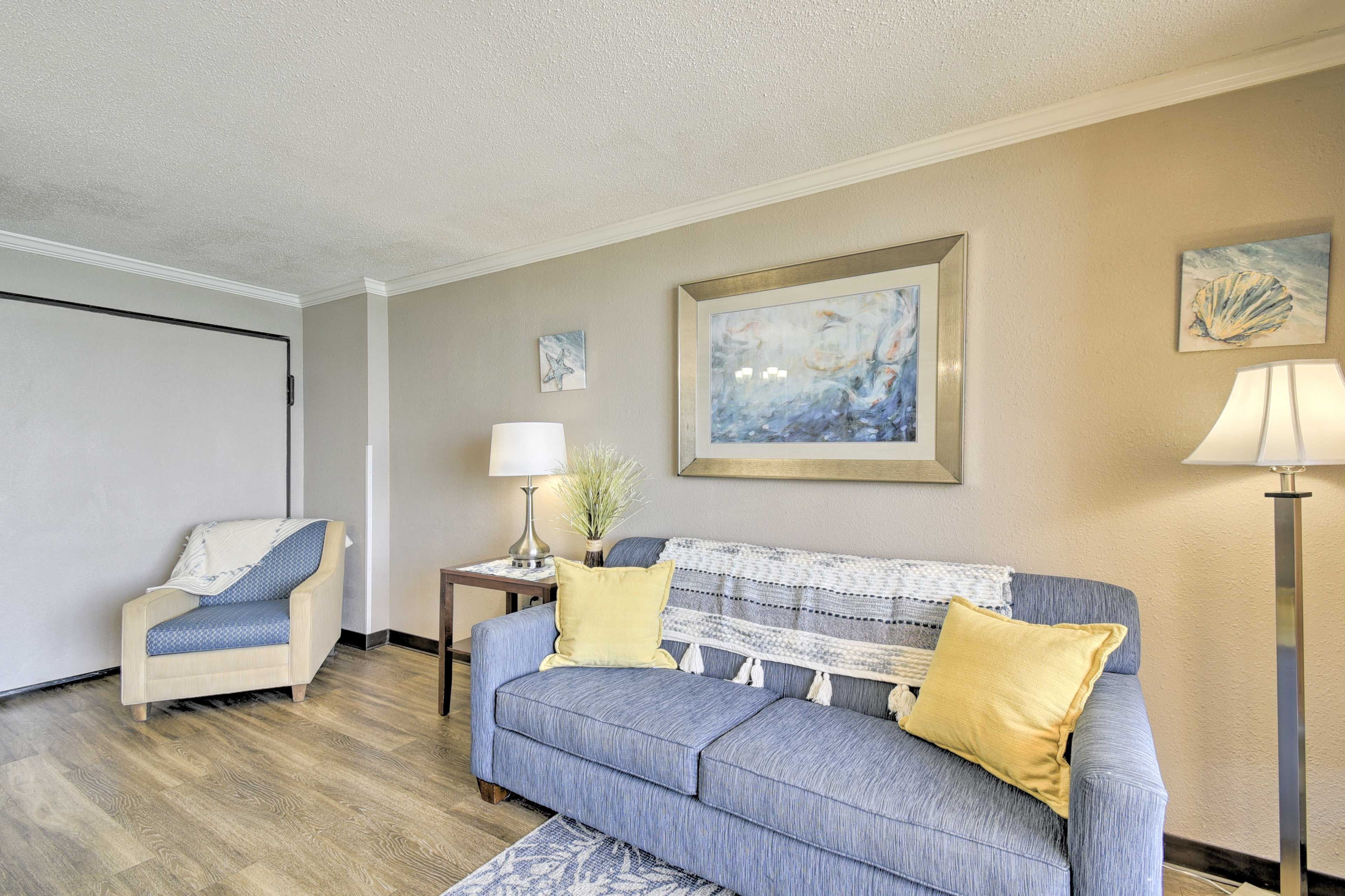 Living Room | Full Murphy Bed | Queen Sleeper Sofa | Window A/C Units