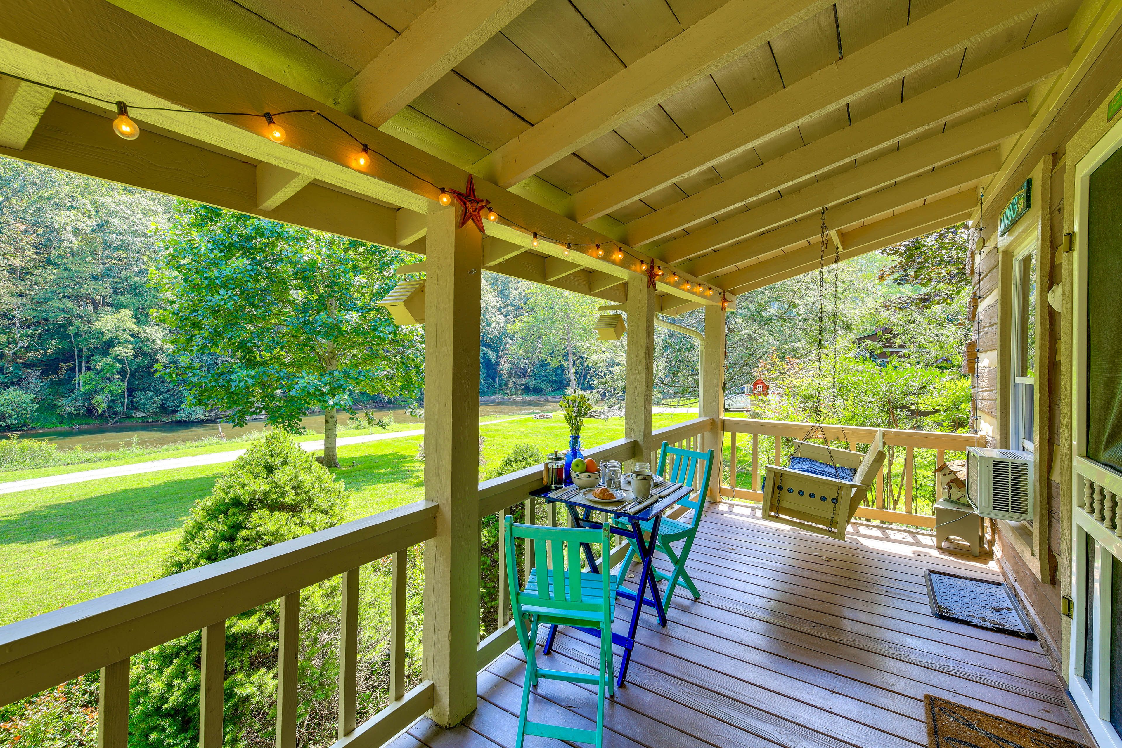 Covered Deck | Swing | Bistro Dining Area | River Views