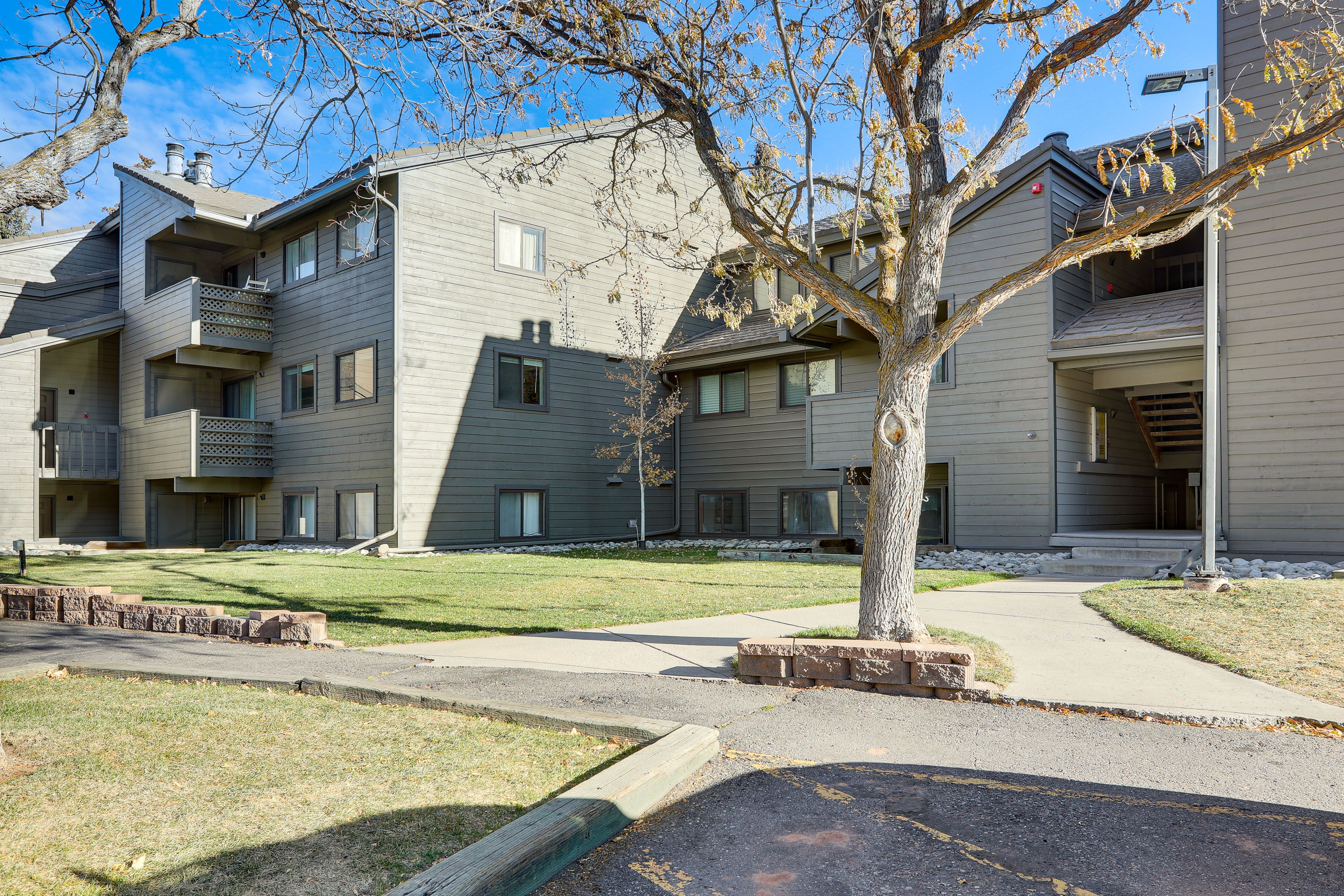 Building Exterior | Mountain Views | Community Parking Lot (2 Vehicles)
