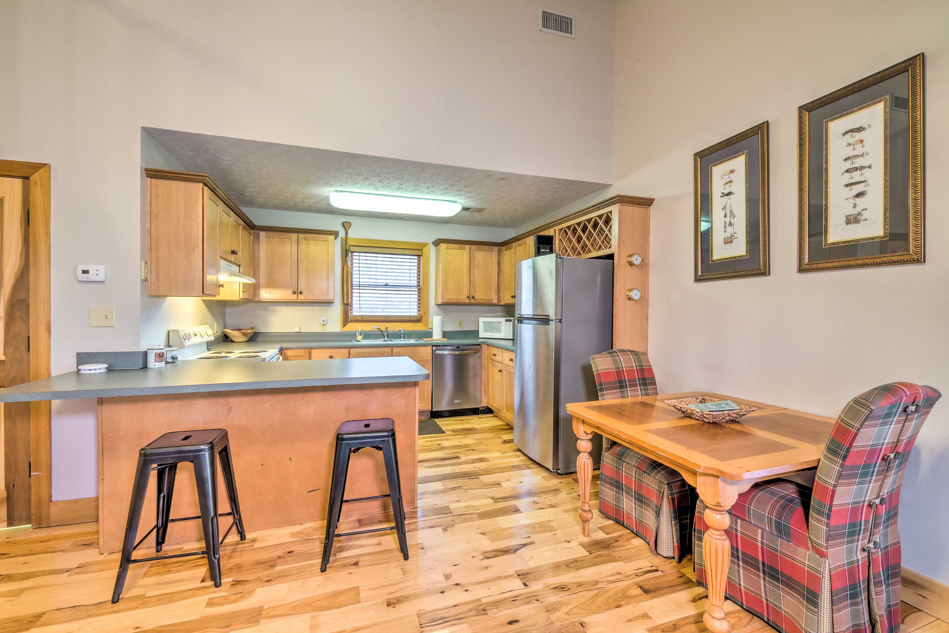 Dining Area | Dishware & Flatware Provided | Breakfast Bar w/ Additional Seating