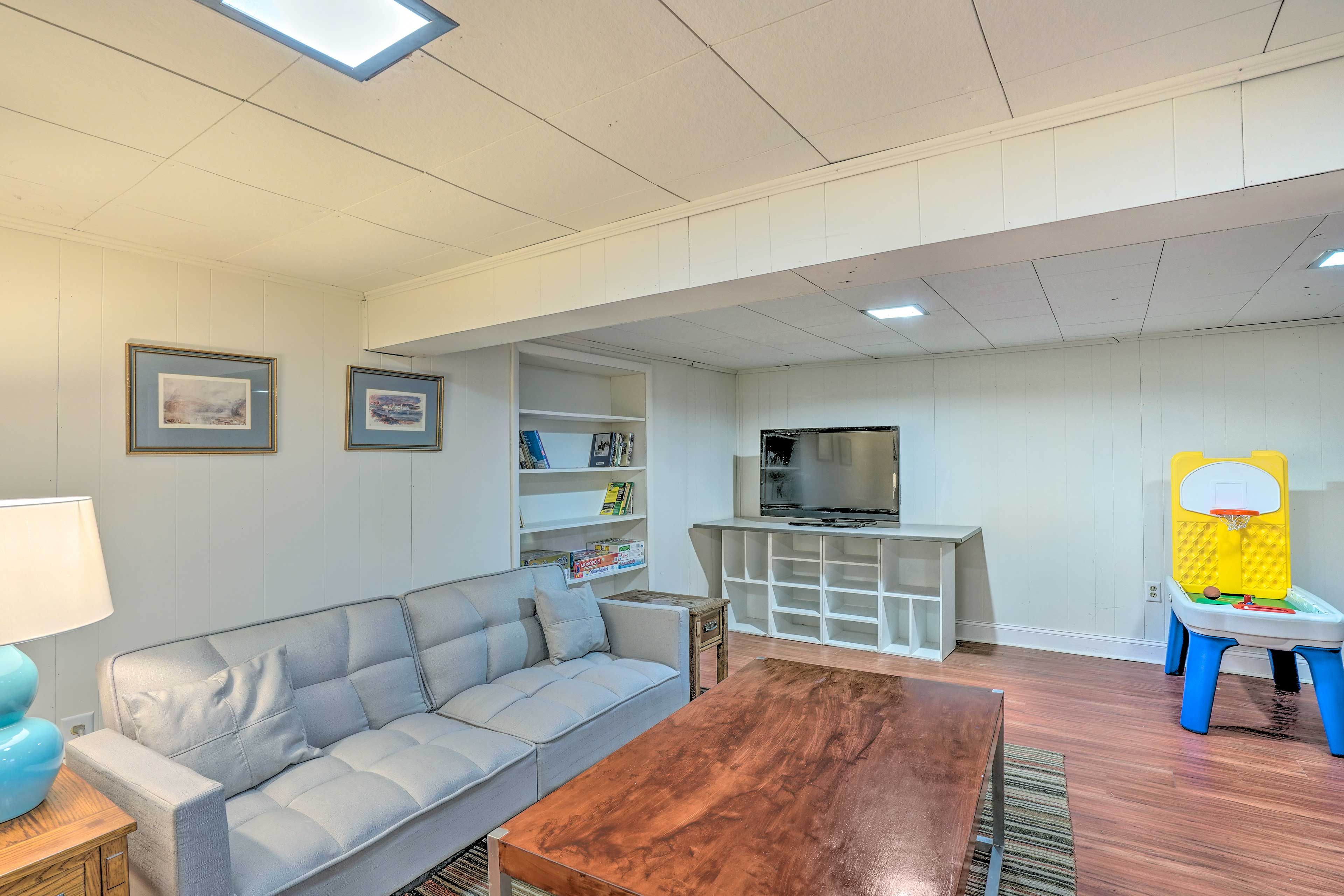 Lower Living Room | Lower Level | Smart TV w/ Cable | Board Games | Books