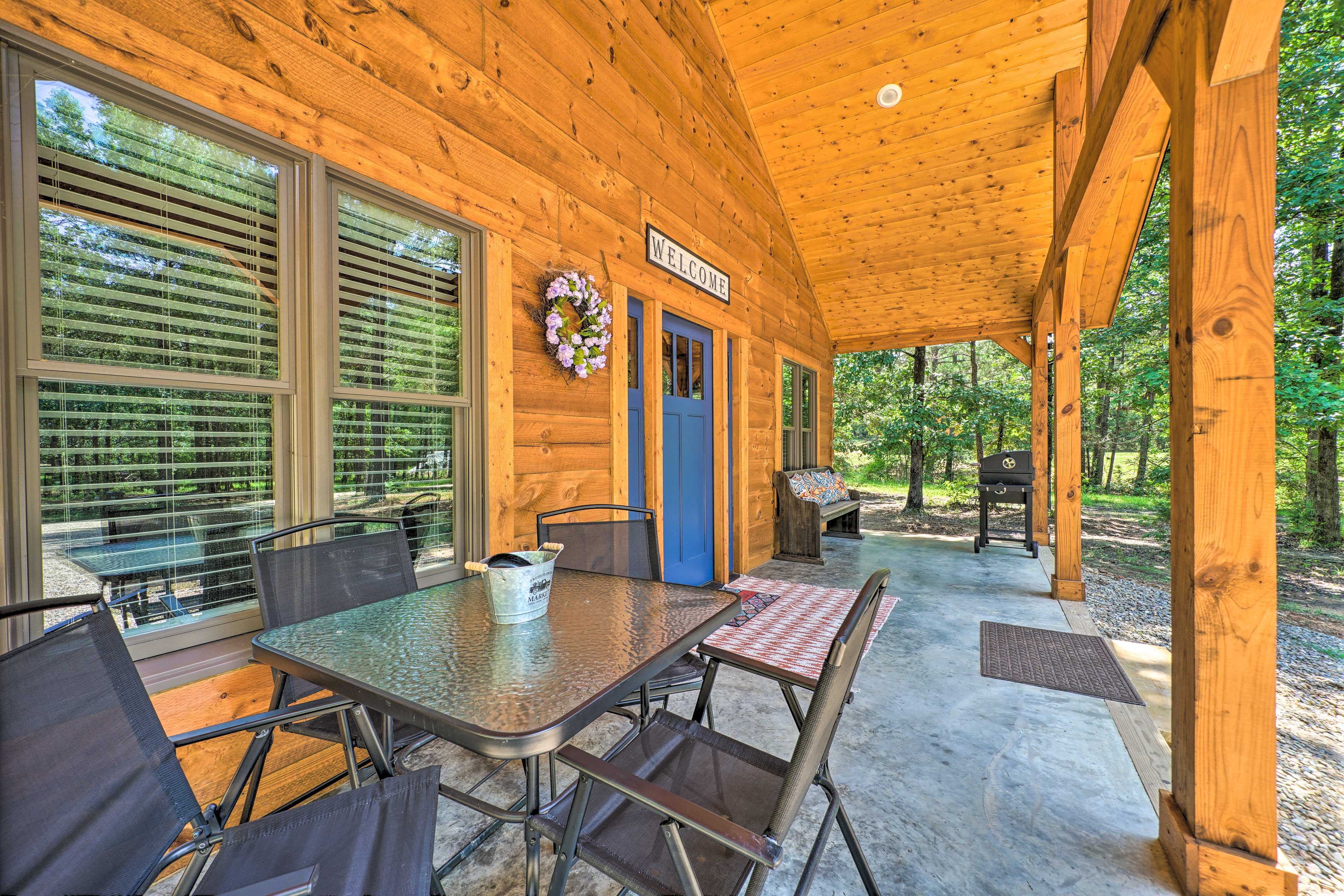 Cabin Exterior | Furnished Patio | Charcoal Grill