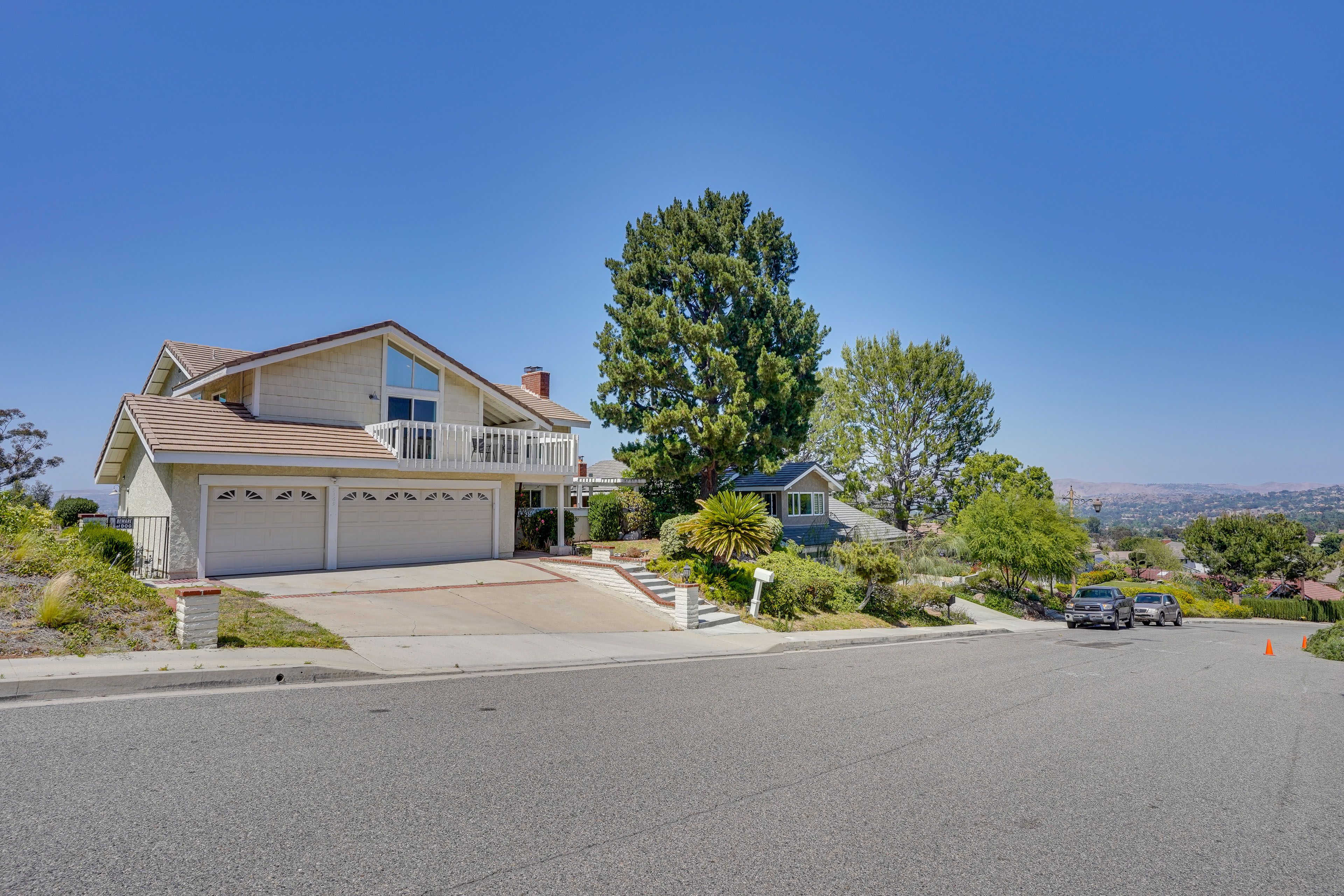 Property Exterior | Garage & Driveway Parking (4 Vehicles) | Free Street Parking