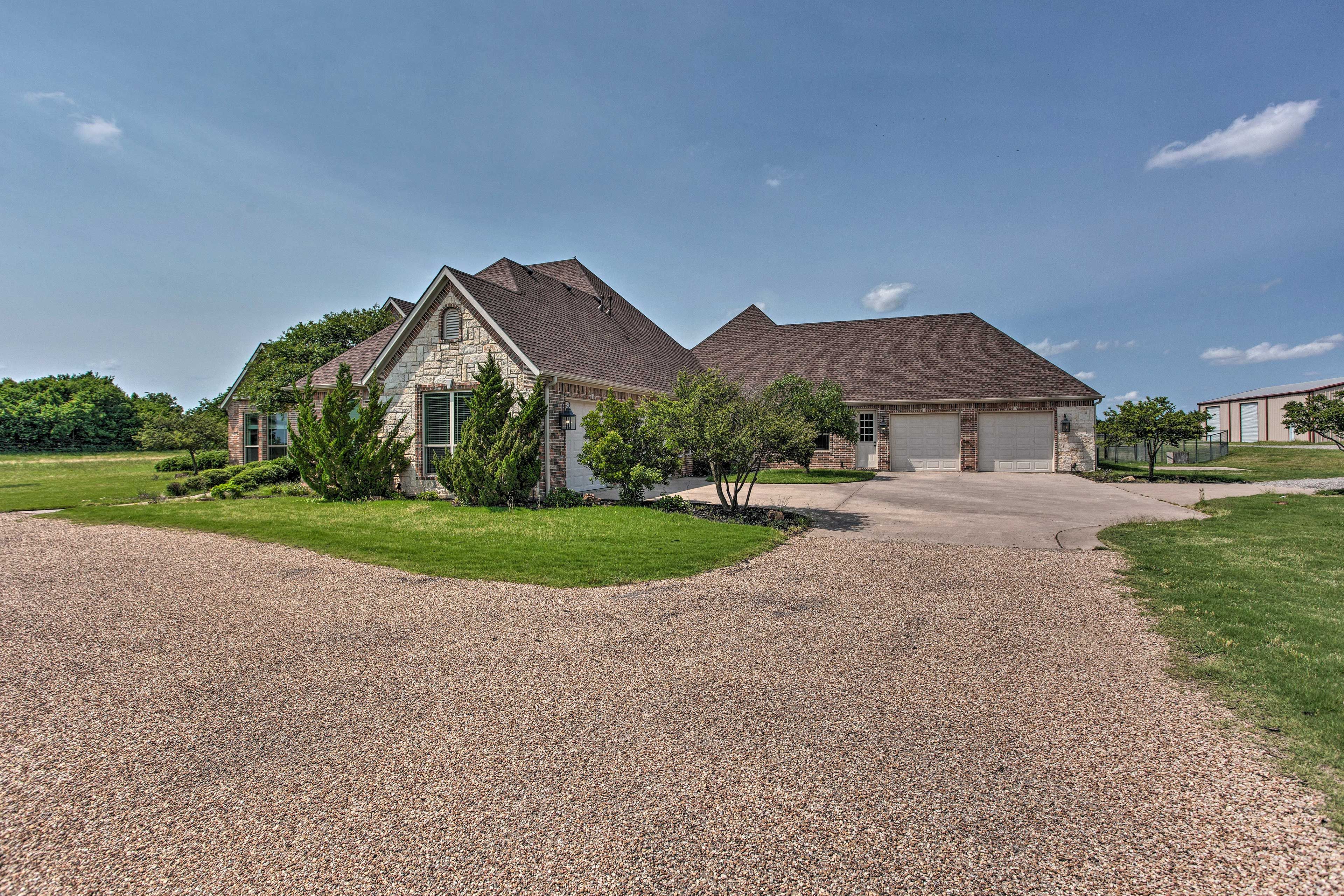 Property Exterior | Garage (4 Vehicles) | Driveway (2 Vehicles)
