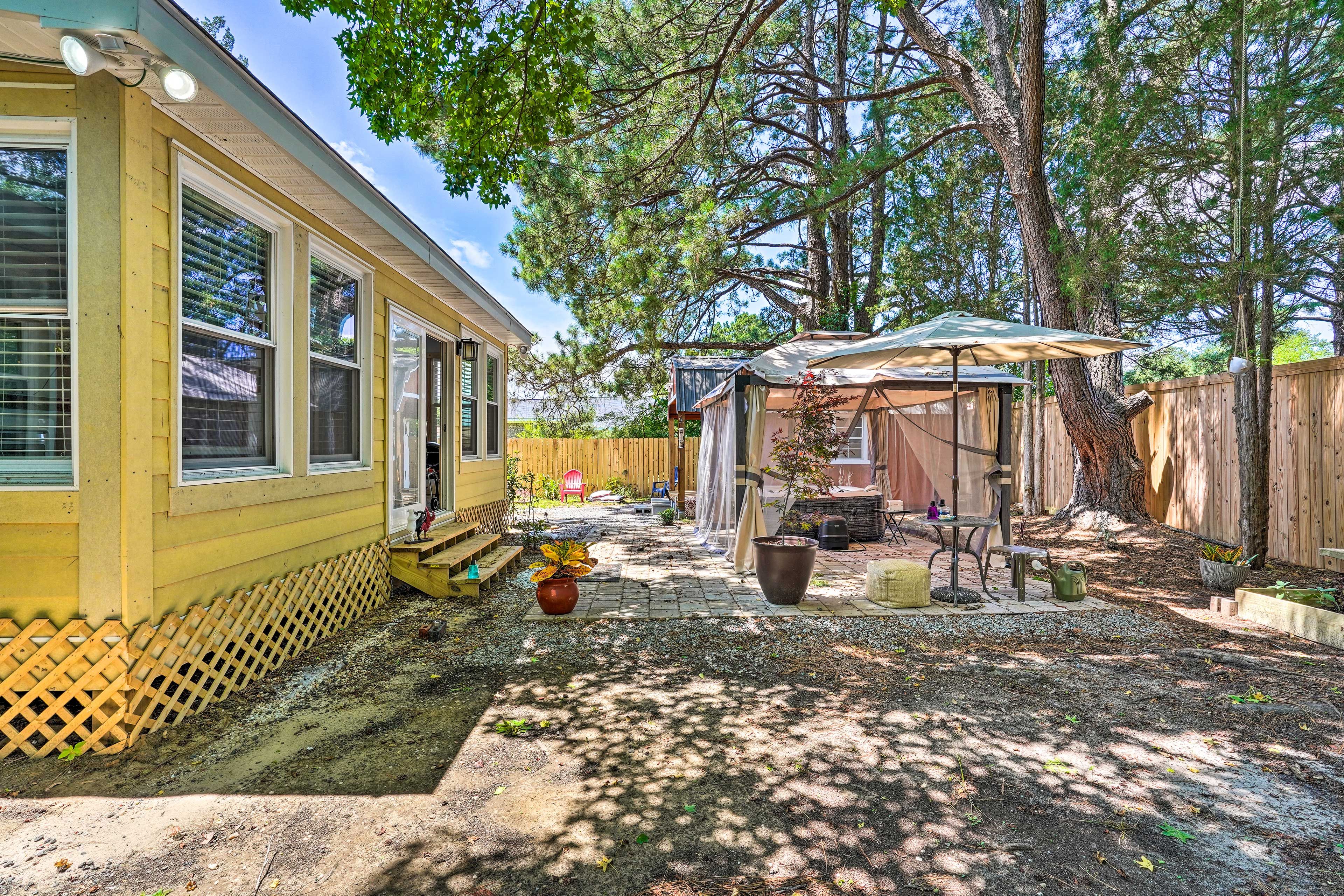 Fenced-In Backyard | Patio | Private Hot Tub | Charcoal Grill