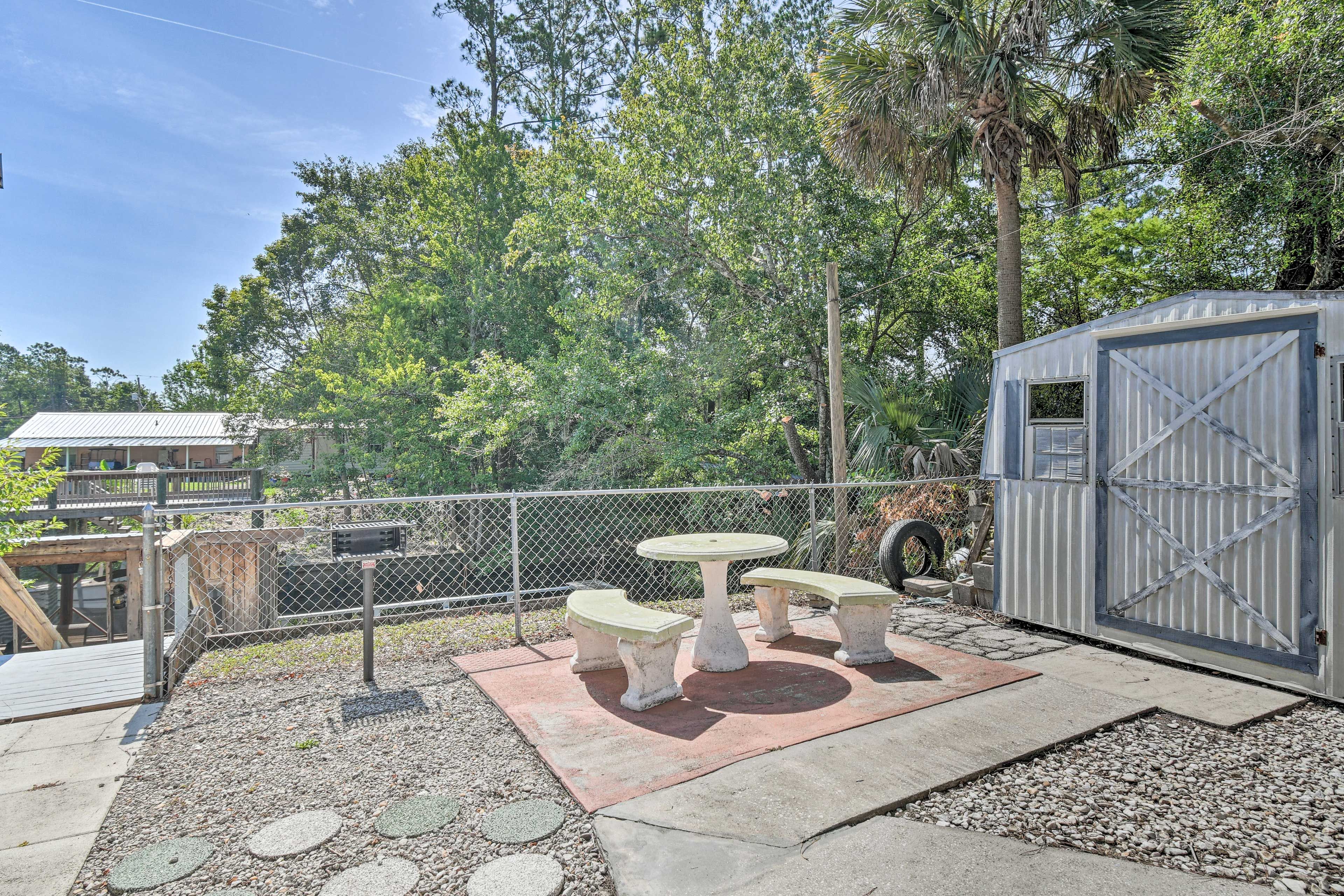 Private Yard | Charcoal Grill (Charcoal Not Provided) | Outdoor Dining Area