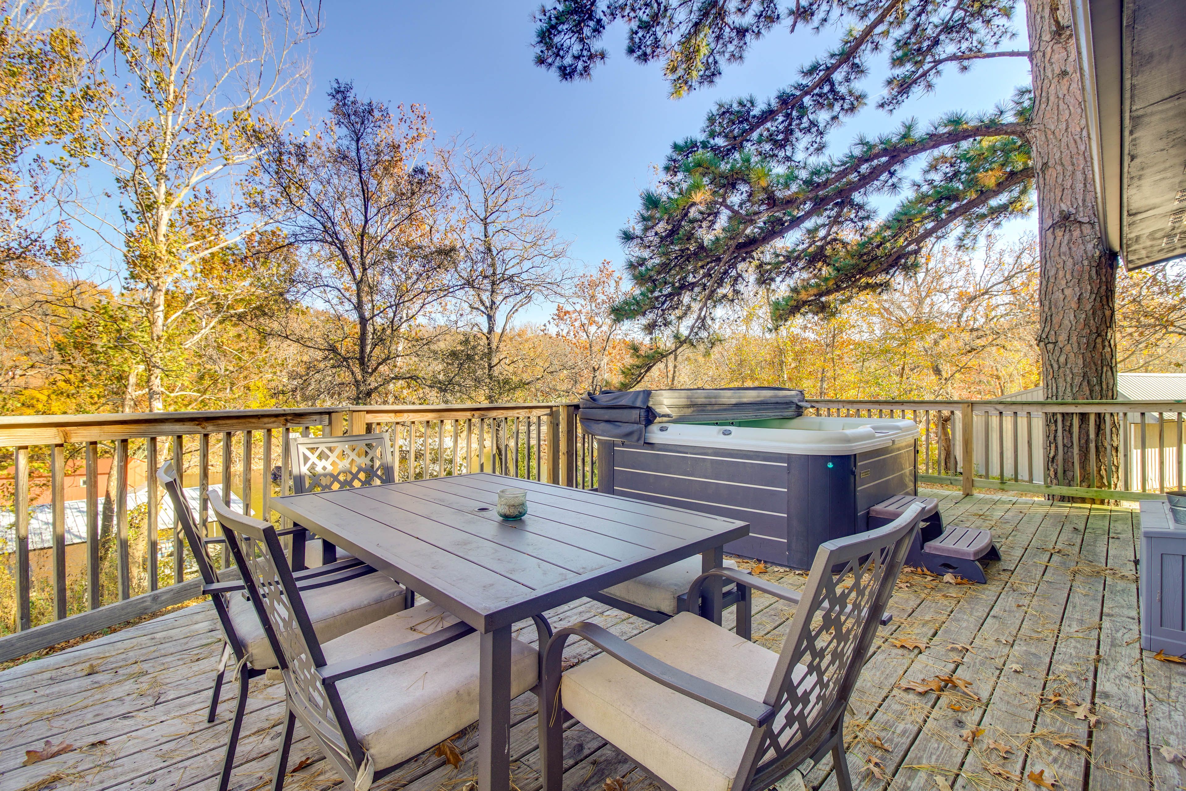 Private Deck | Hot Tub | Charcoal Grill | Outdoor Dining Area | Lake Views