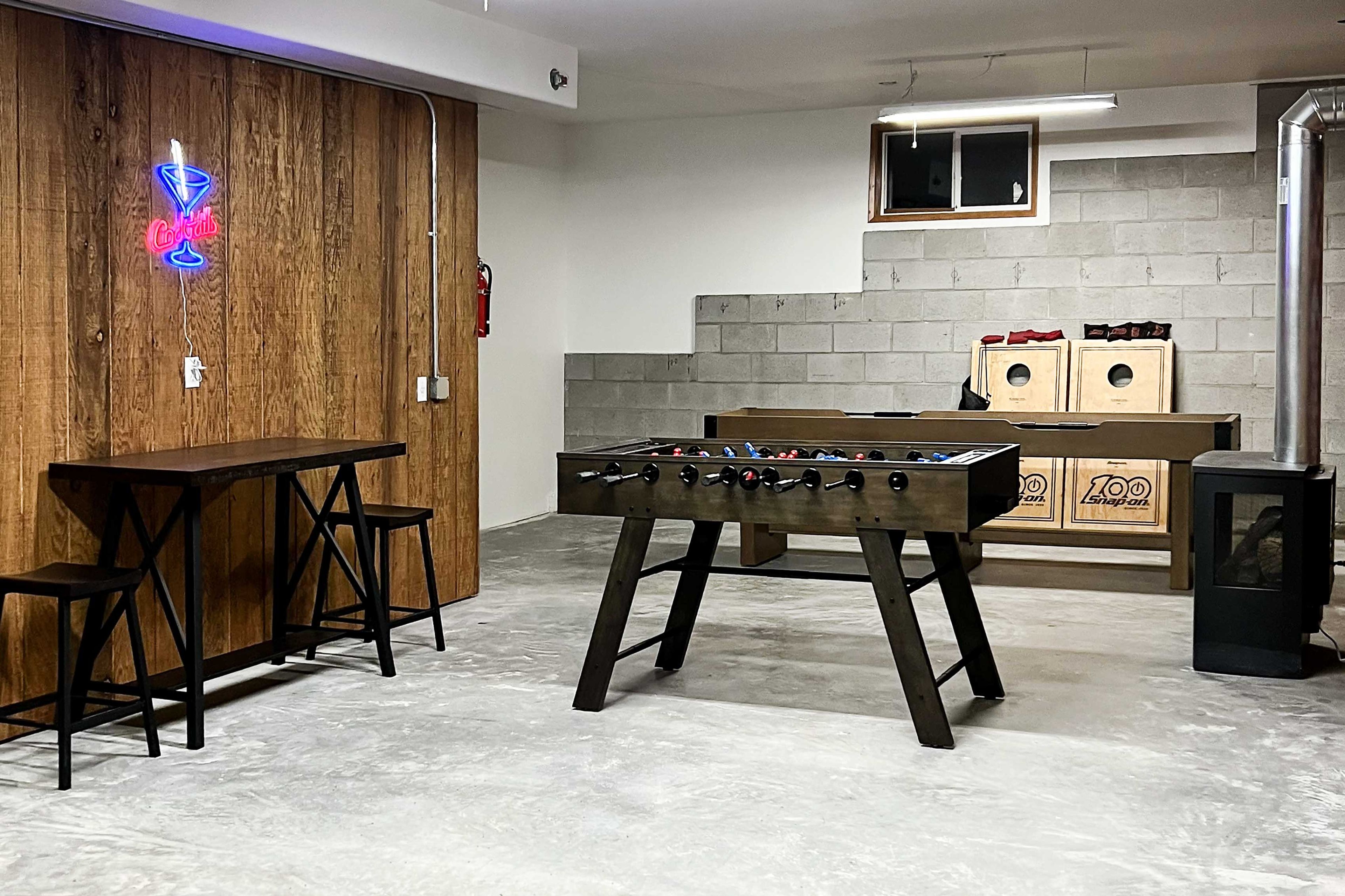 Game Room | Lower Level | Foosball | Shuffleboard | Darts | Cornhole | Fireplace