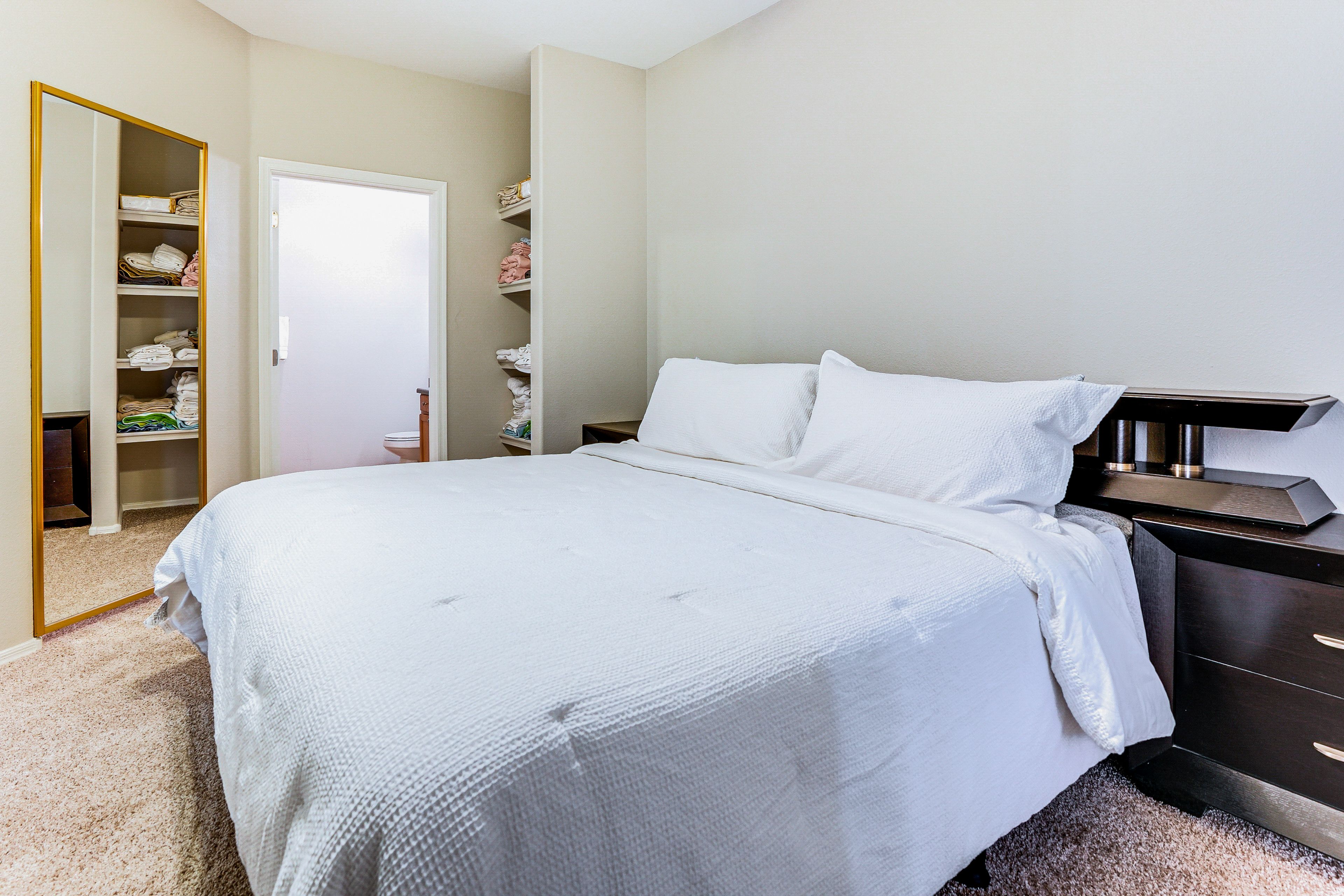 Bedroom 1 | King Bed | Linens & Towels | Balcony Access | Full En-Suite Bathroom