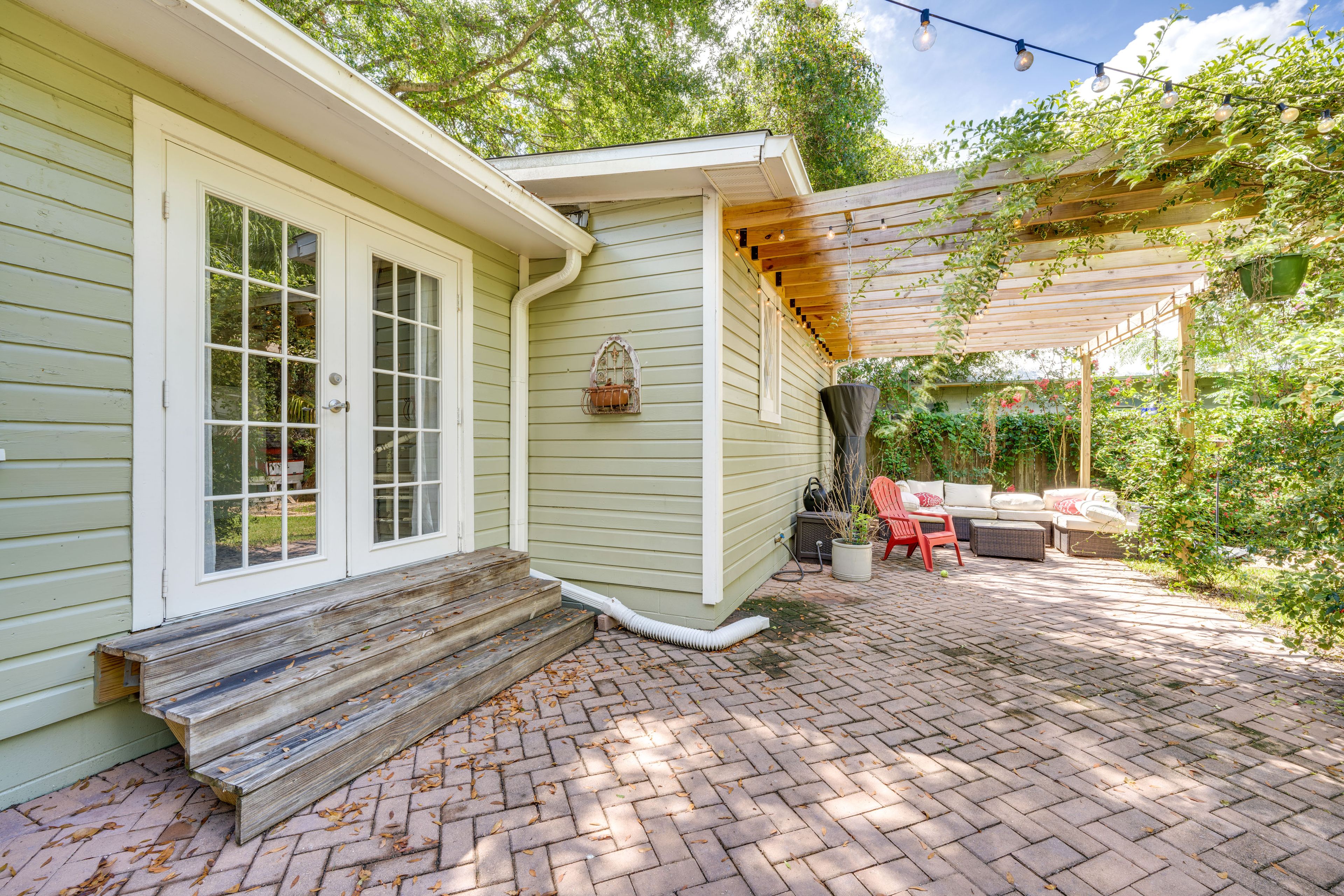 Cottage Entrance | Shared Patio | Bistro Lights