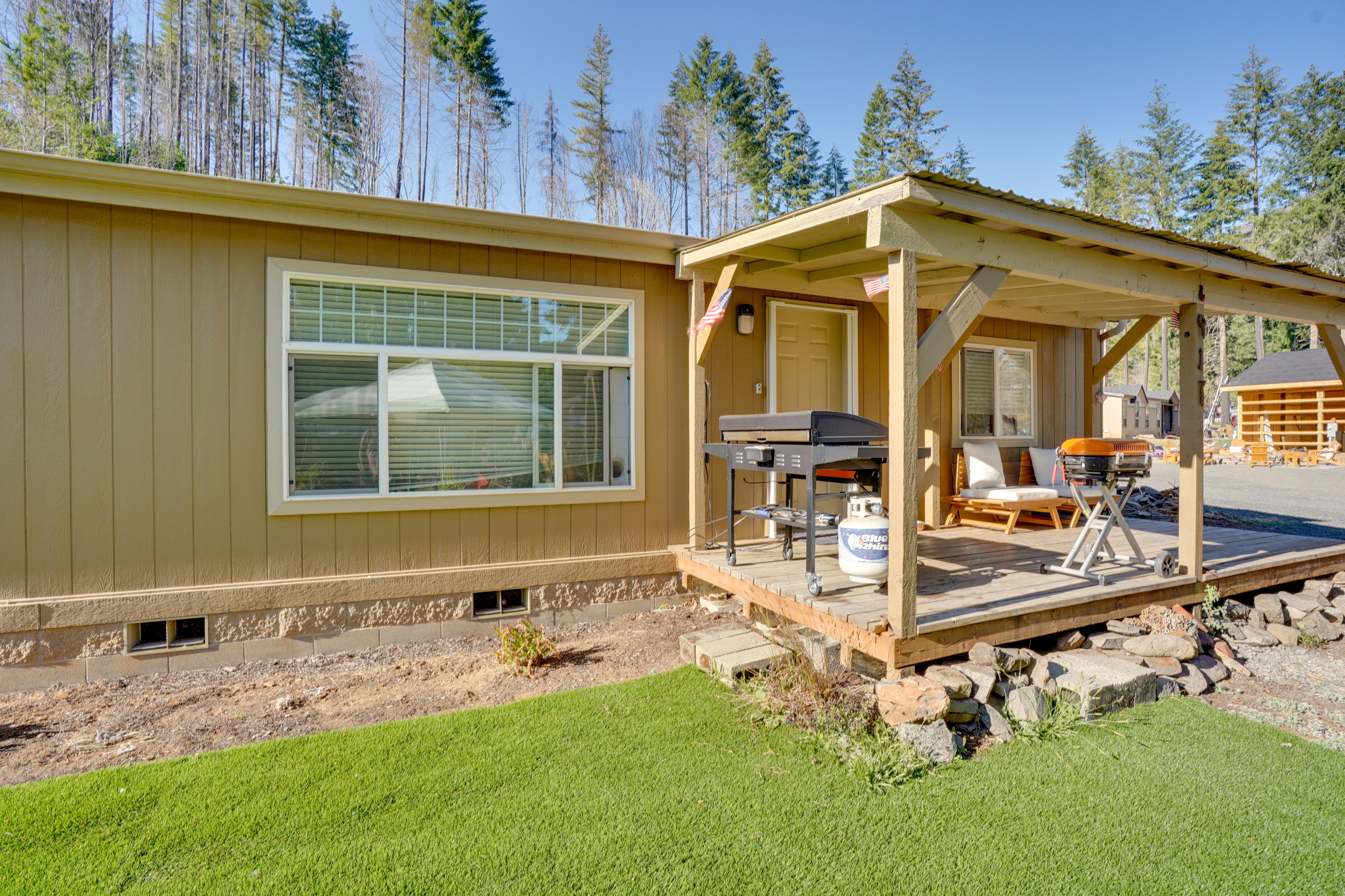 House Exterior | Furnished Deck | Charcoal Grill | Gas Grill