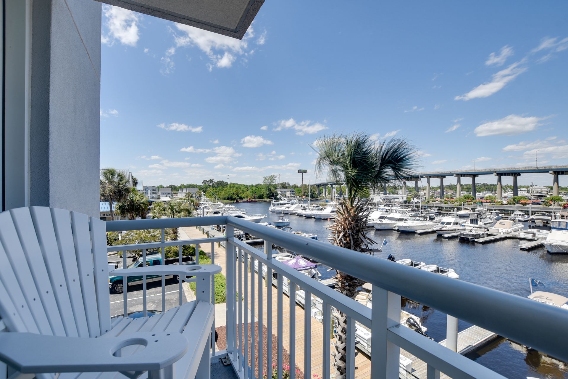 Porch chairs overlooking Harbourgate Marina from Condo #100