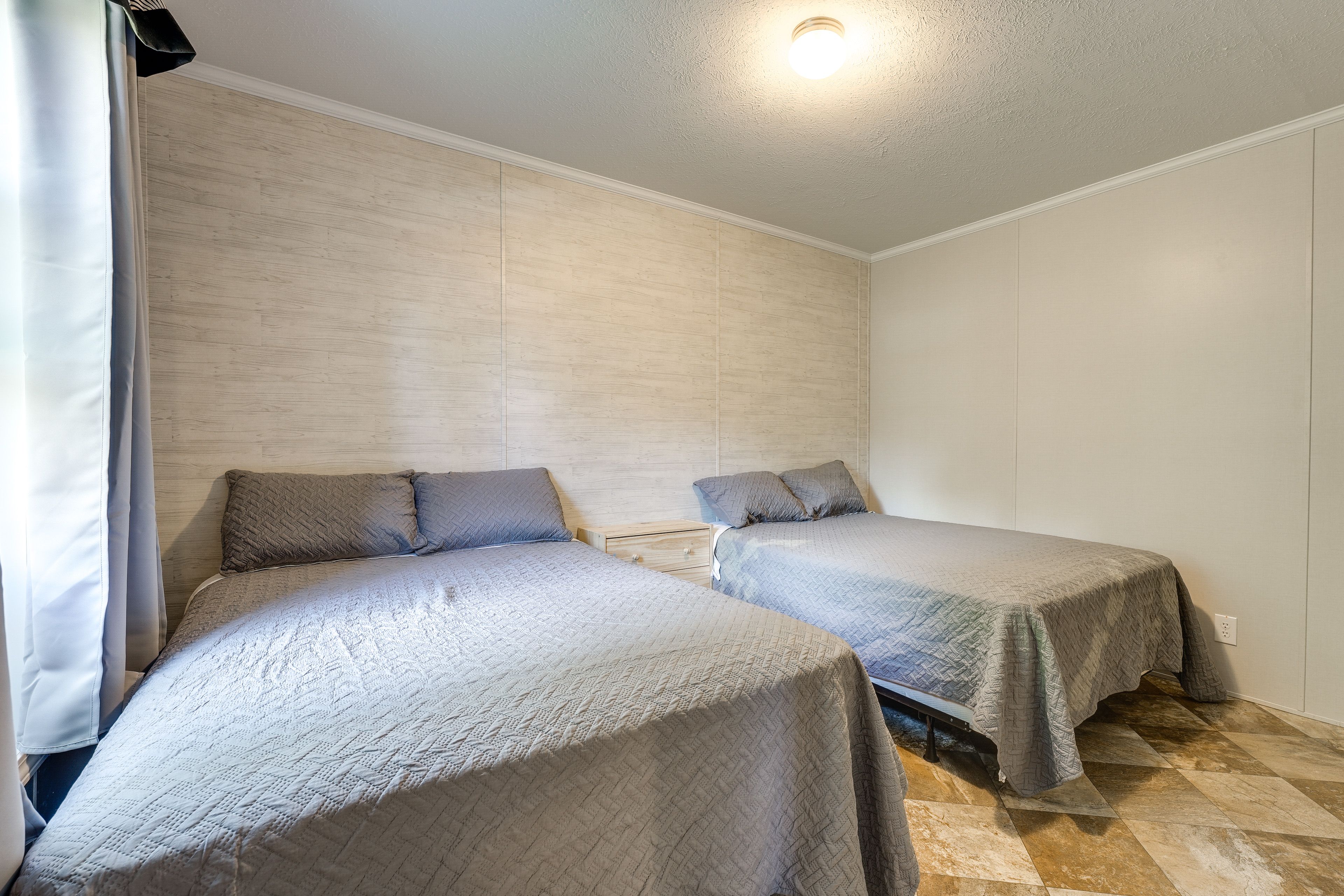 Bedroom 1 | 2 Full Beds | Linens & Towels Provided