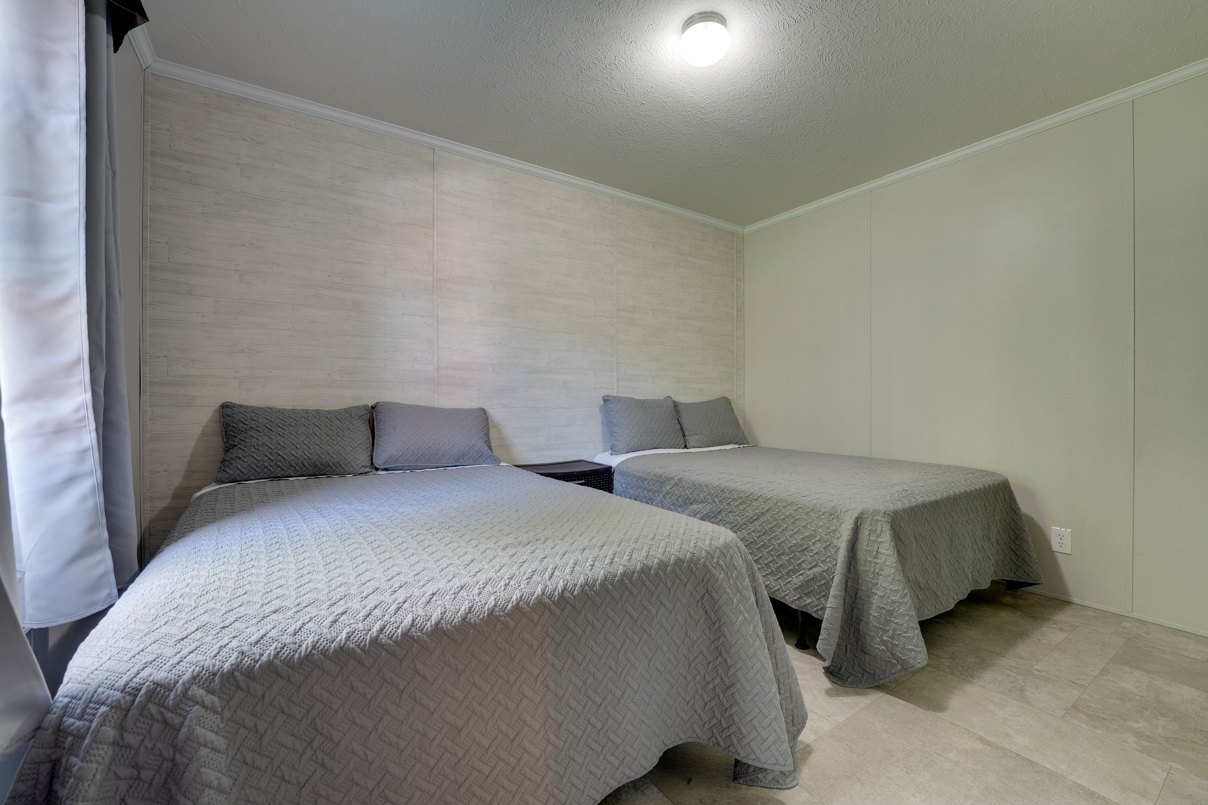 Bedroom 1 | 2 Full Beds | Linens Provided