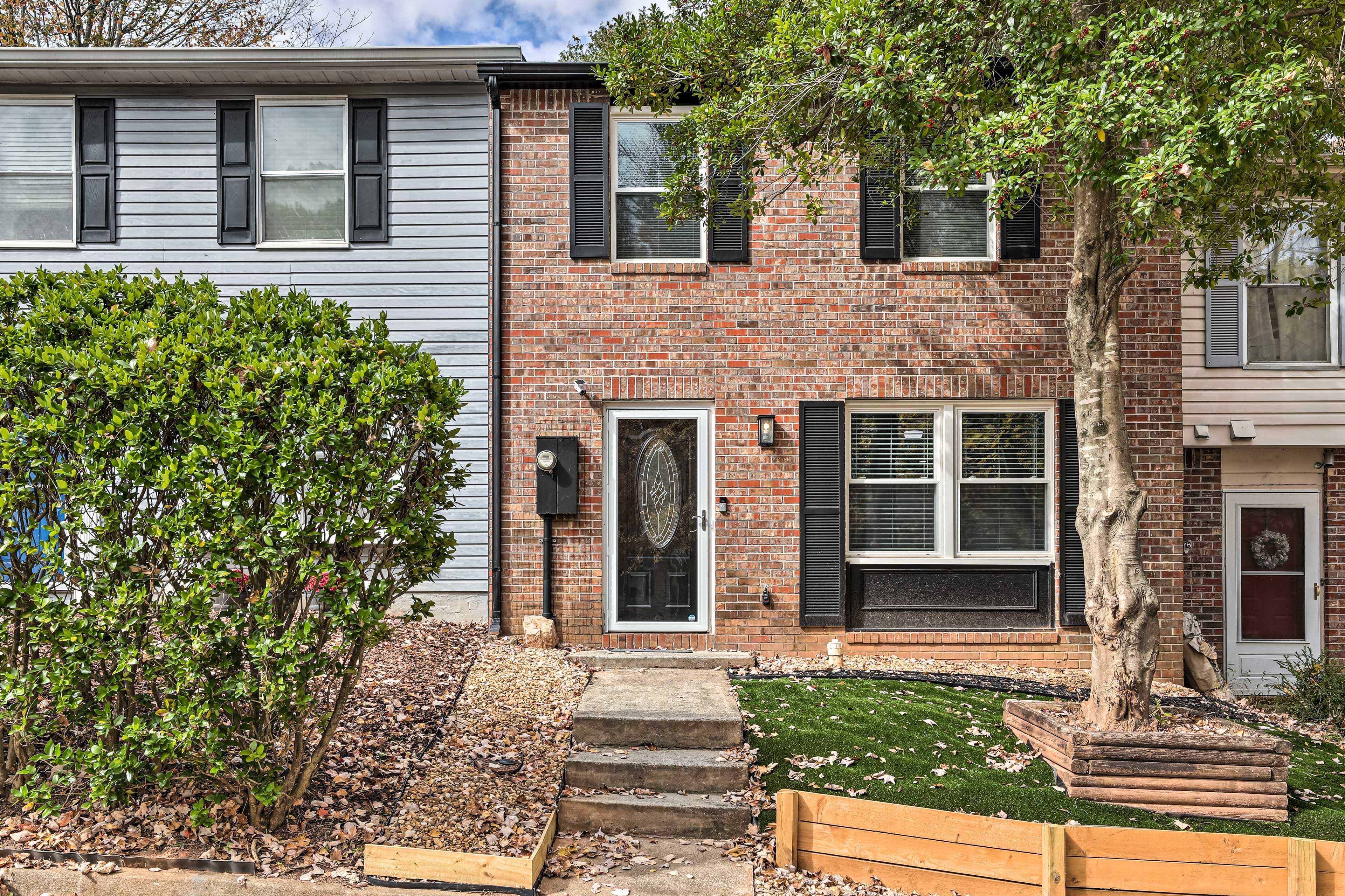 Townhome Exterior | Community Parking Lot (2 Assigned Spots)