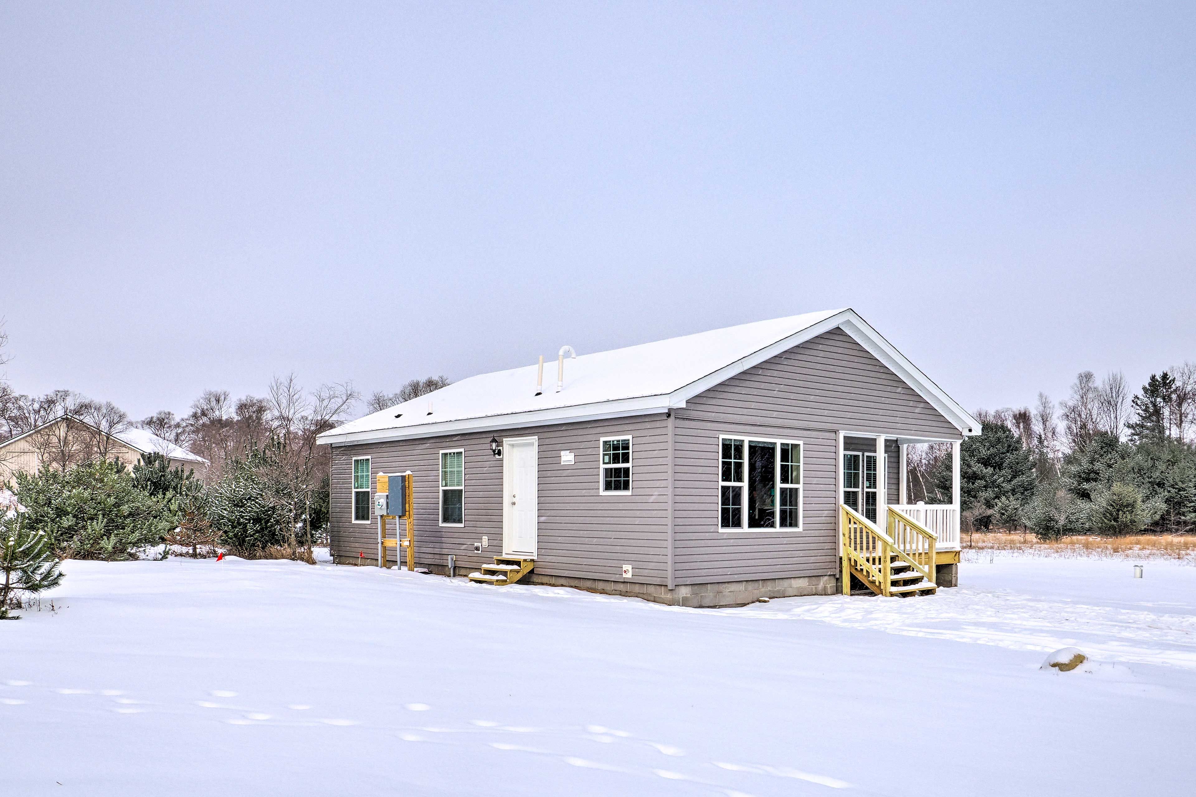 Winter Exterior | Front Porch w/ Seating | Spacious Yard | Fire Pit