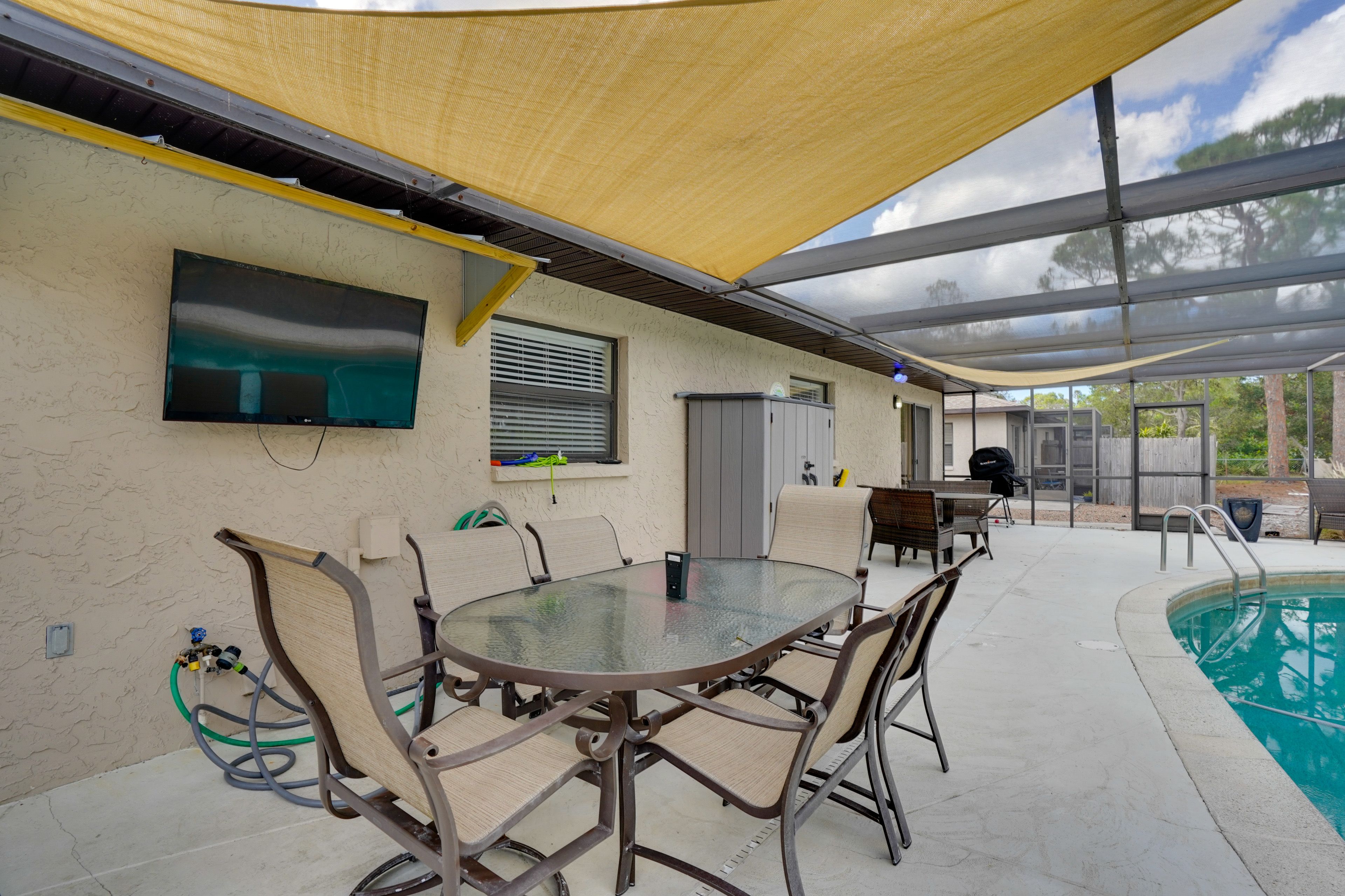 Screened Lanai | Outdoor Dining | TV | Shared Pool