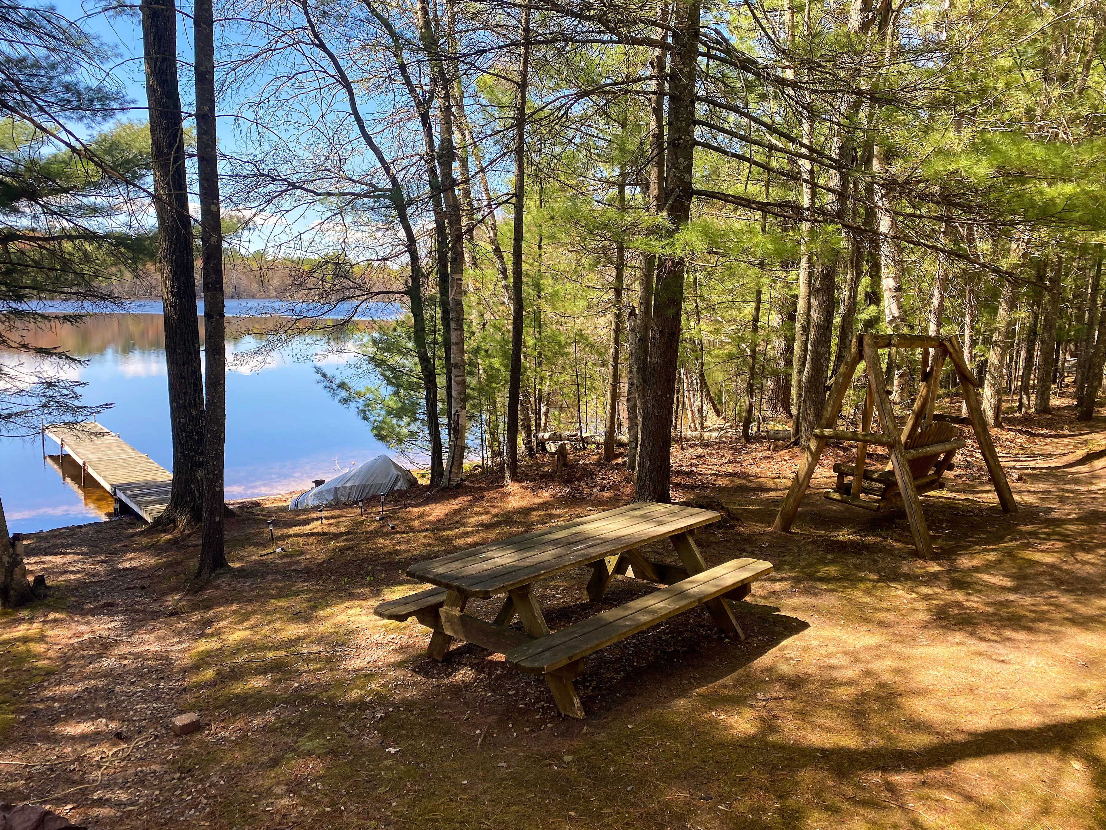 Private Yard | Picnic Table | Bench Swing | Lake Views | Swimming Access