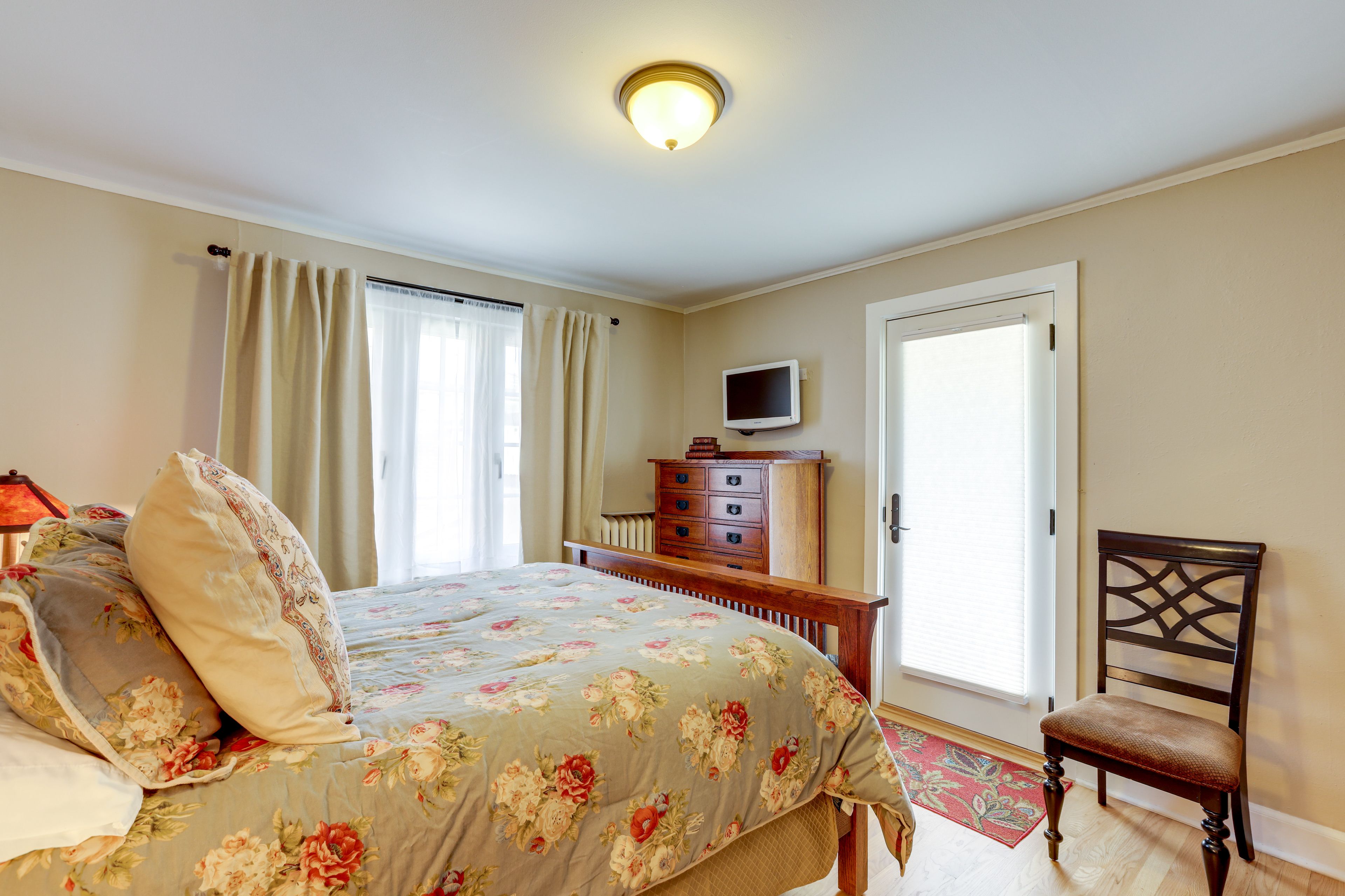 Bedroom 1 | Queen Bed | Flat-Screen TV w/ Cable | Backyard Access