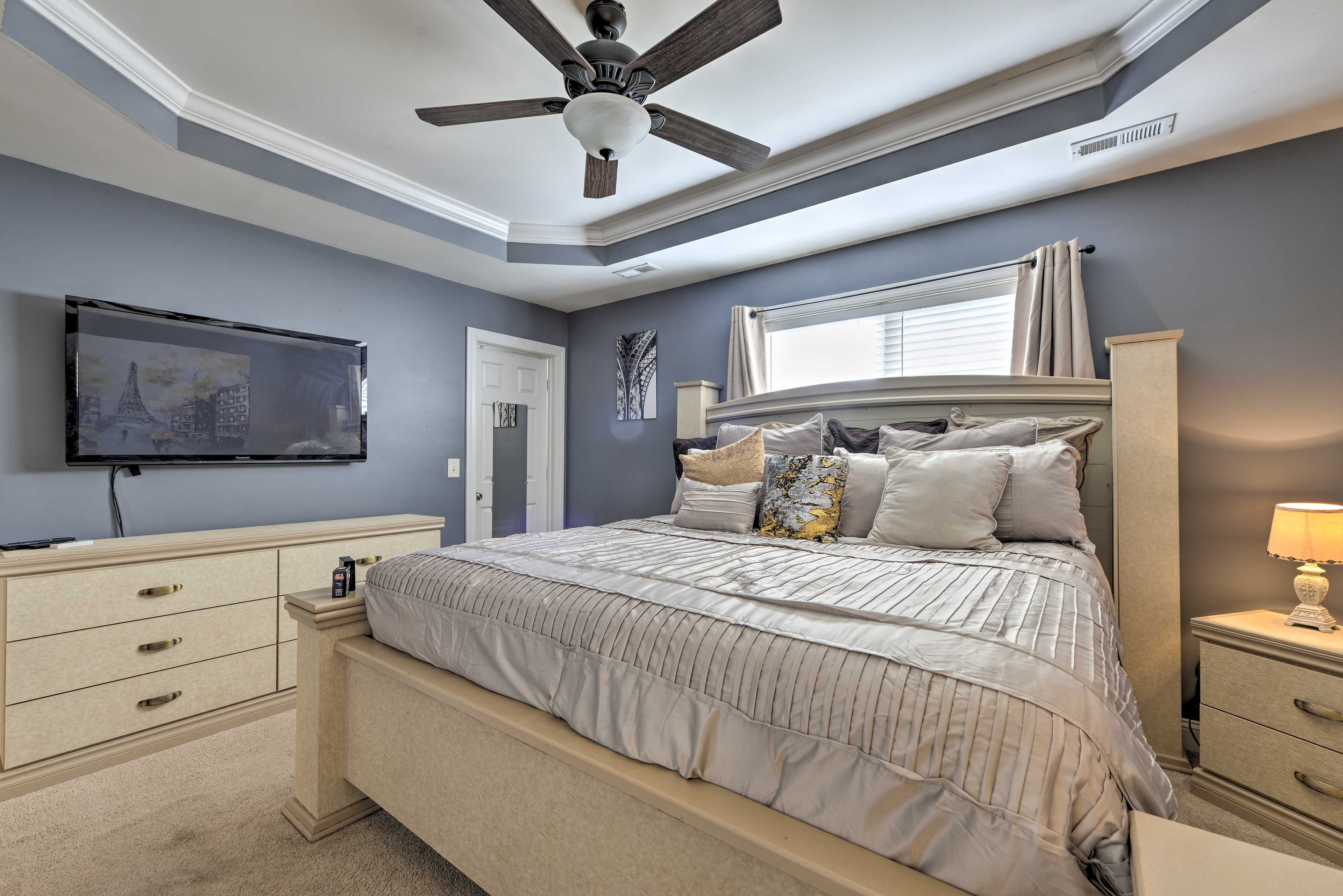 Bedroom 1 | King Bed | Flat-Screen TV | En-Suite Bathroom | Walk-In Closet