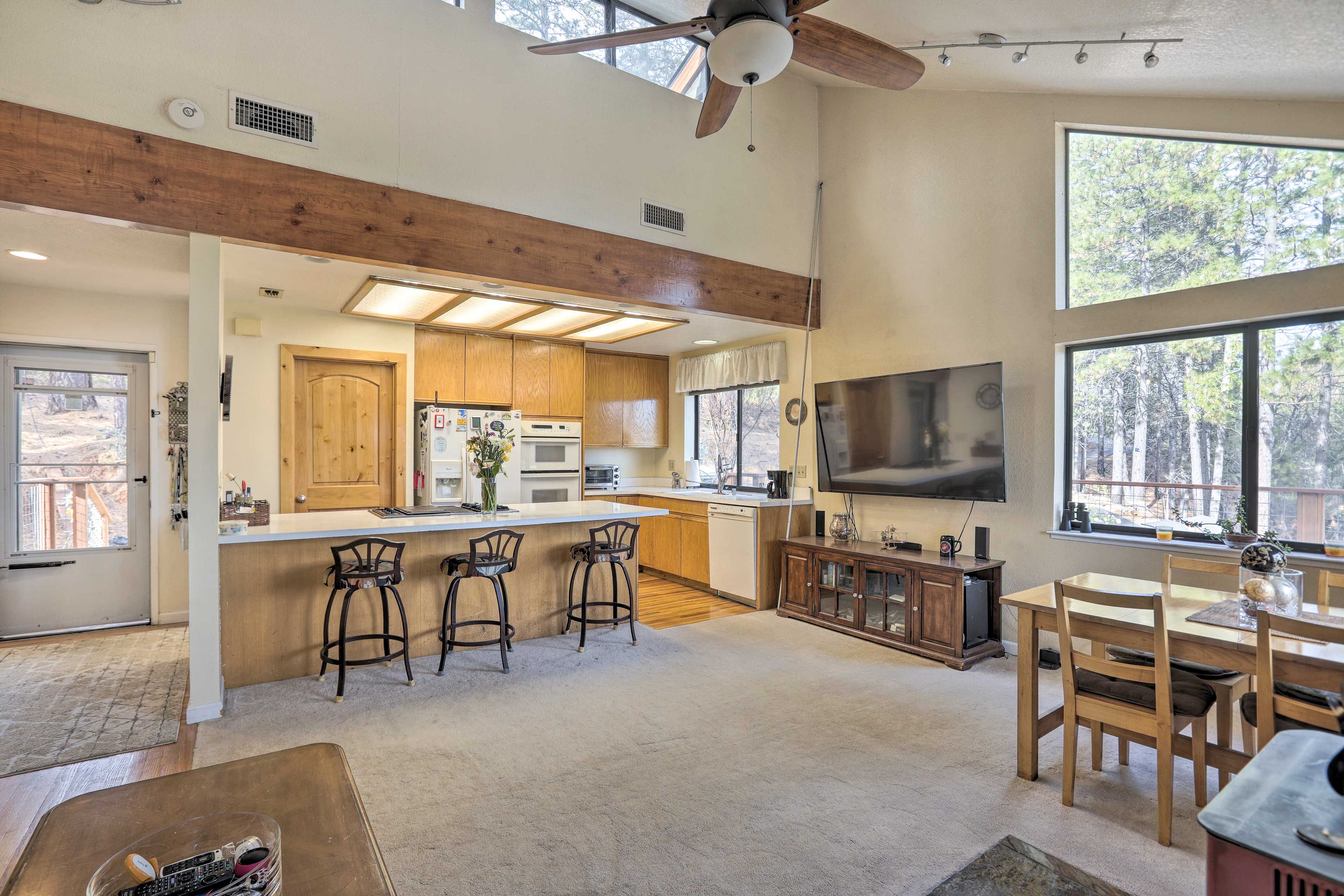 Dining Area | Dishware & Flatware Provided | Breakfast Bar w/ Additional Seating