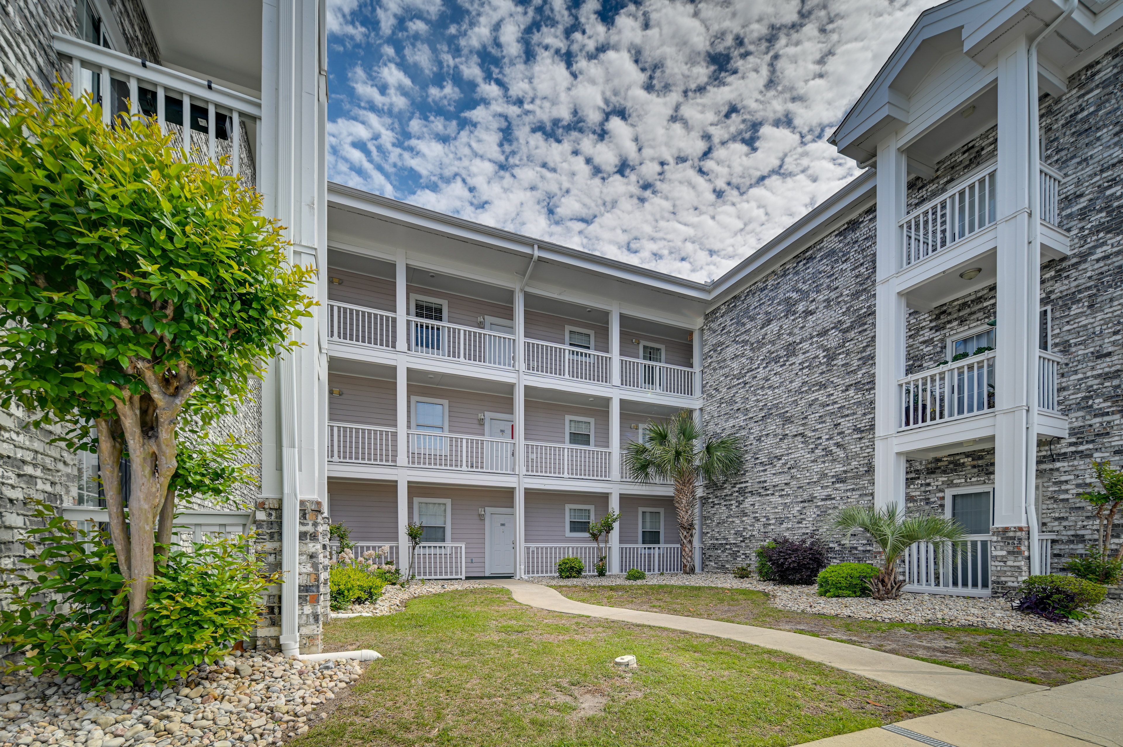 Condo Exterior | 1,120 Sq Ft | 3rd-Floor Condo | Community Outdoor Pool