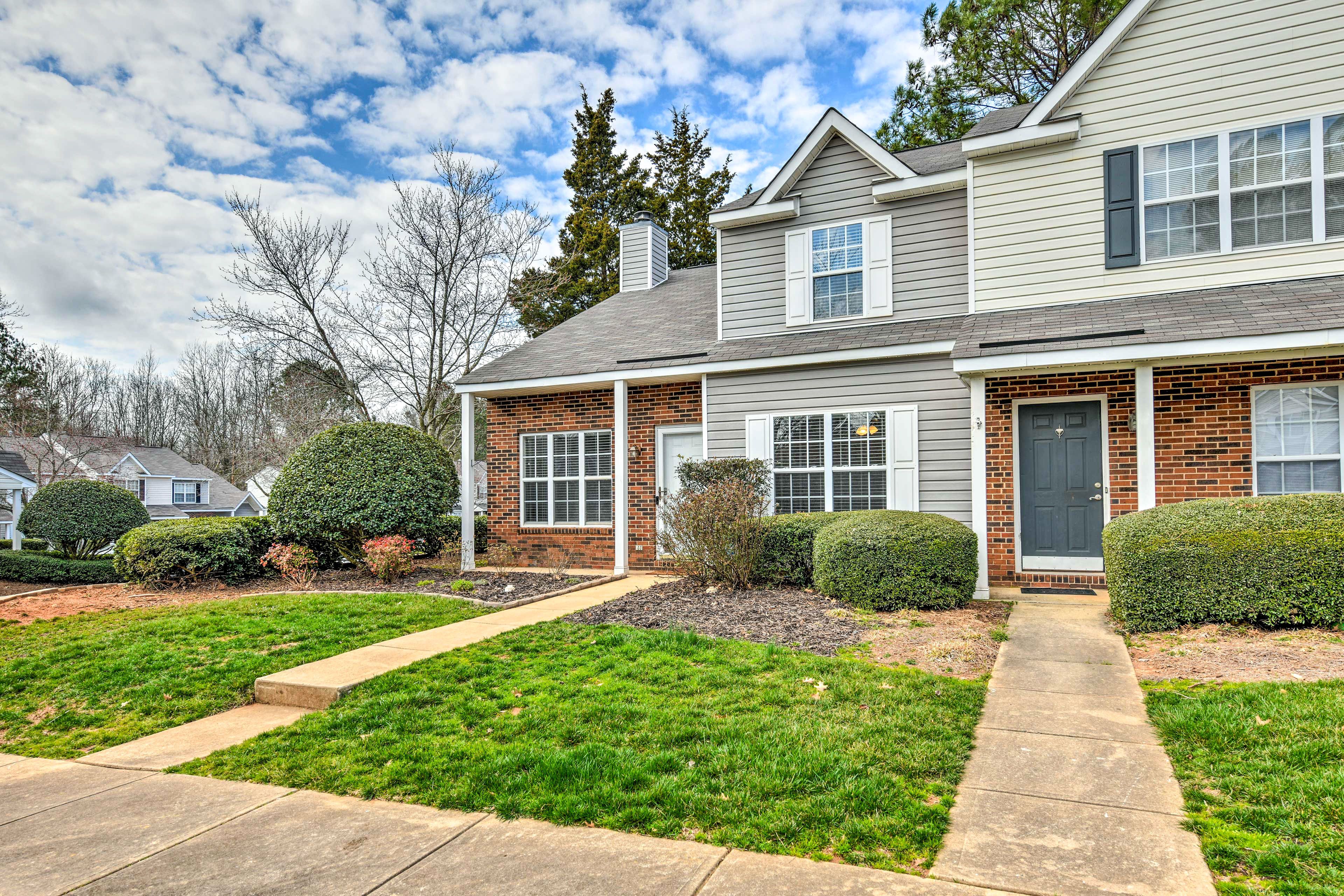 Townhome Exterior | Shared Parking Lot (2 Vehicles)