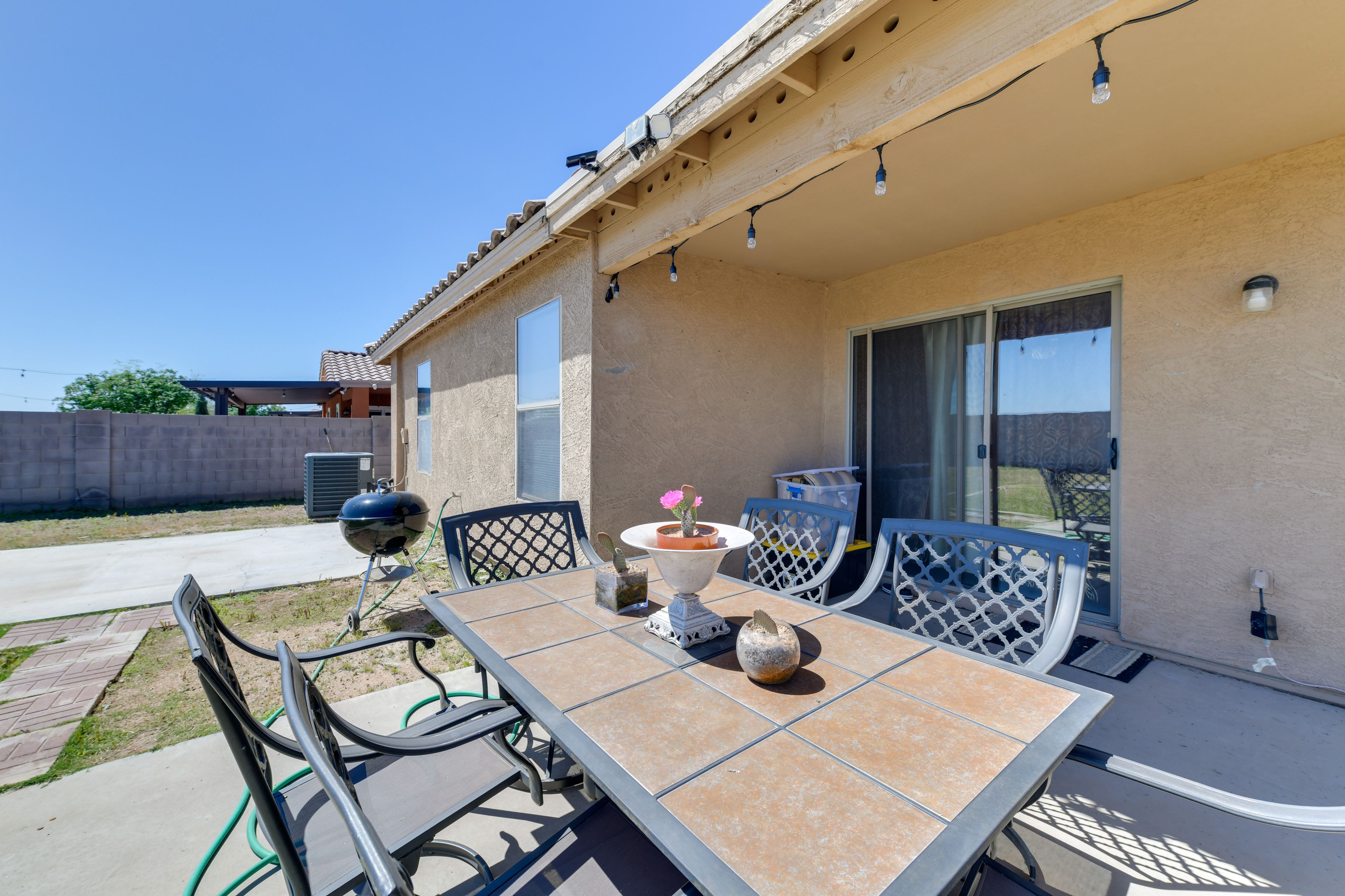 Fenced Yard | Outdoor Dining Area | Charcoal Grill