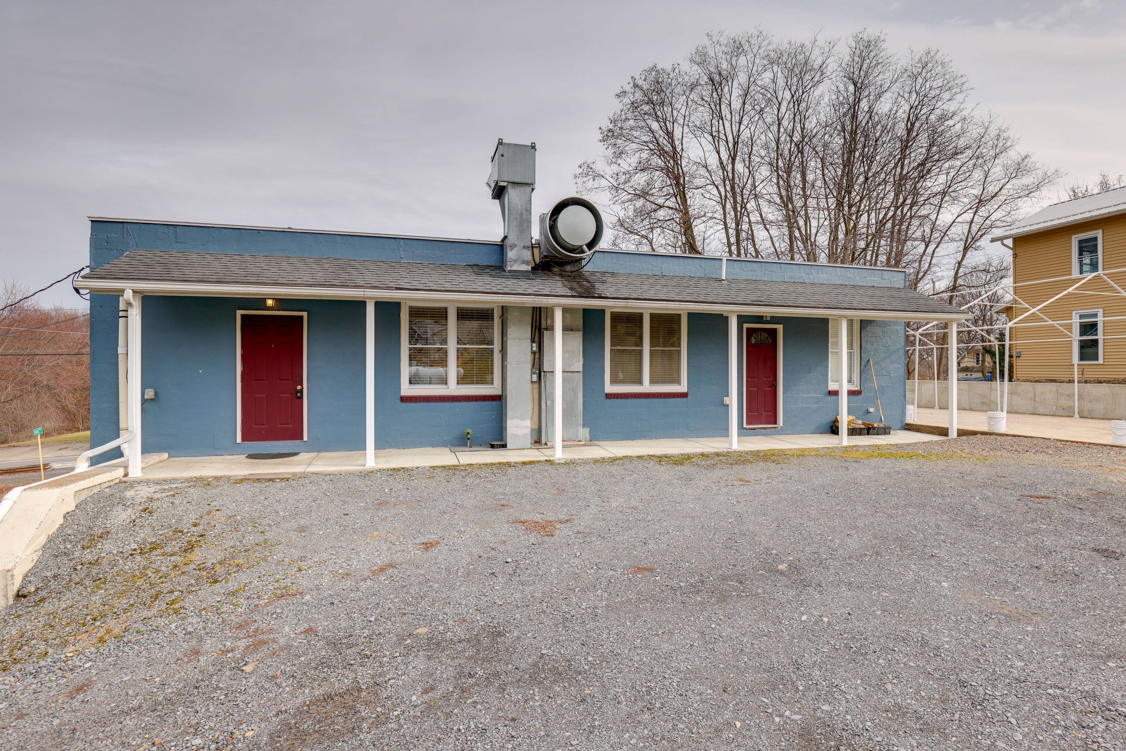 Unit Entrance | Open Gravel Parking Lot | RV/Trailer Parking Allowed