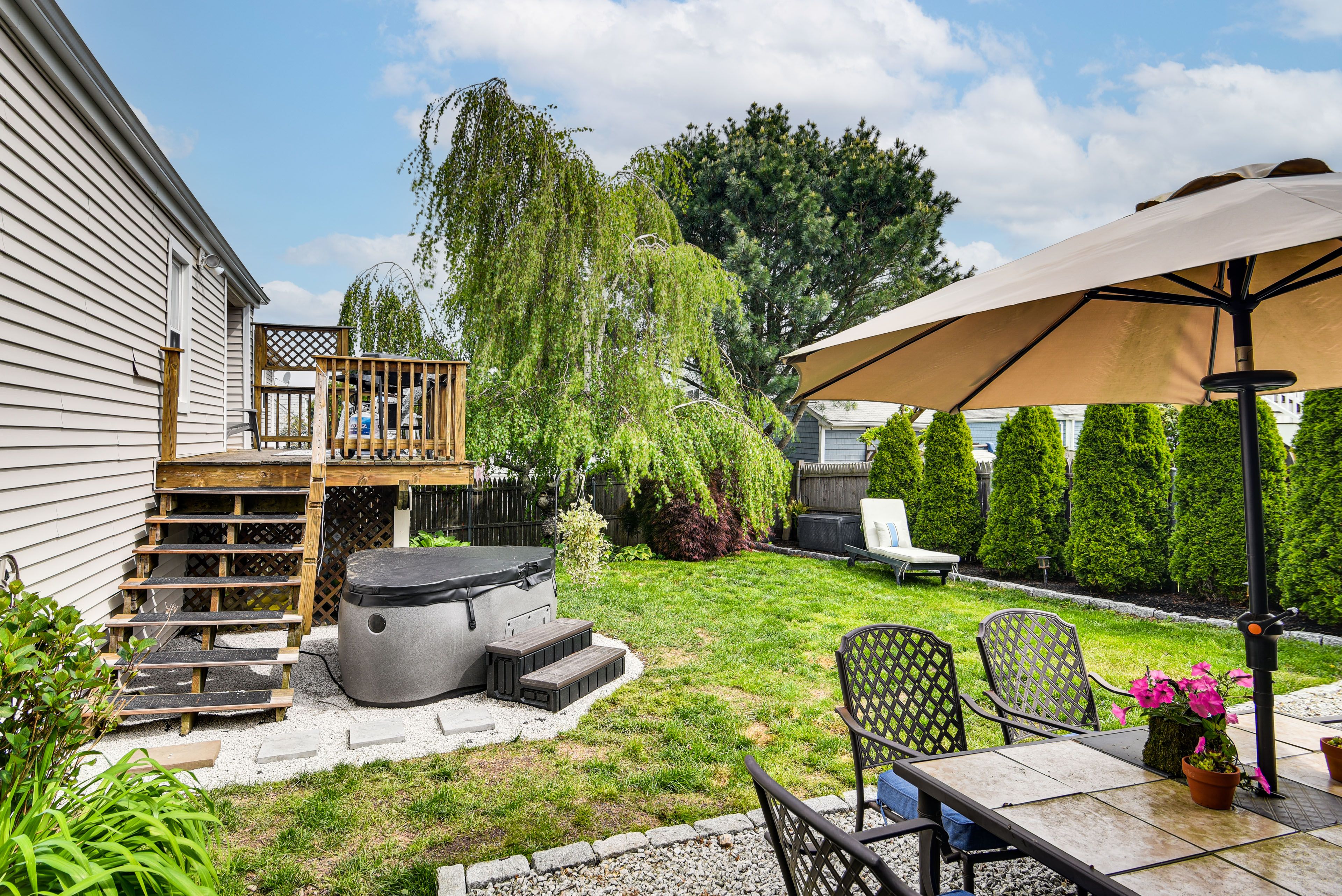 Home Exterior | Hot Tub | Fenced Backyard | Patio | Dining Table | Chiminea
