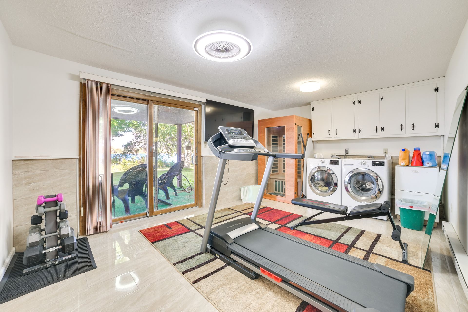 Home gym — lower level, sauna, washer & dryer