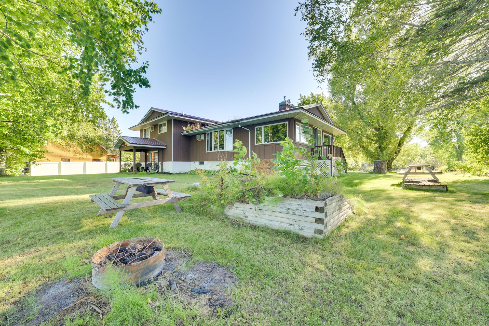 Large yard — wood-burning fire pit, picnic tables, waterfront