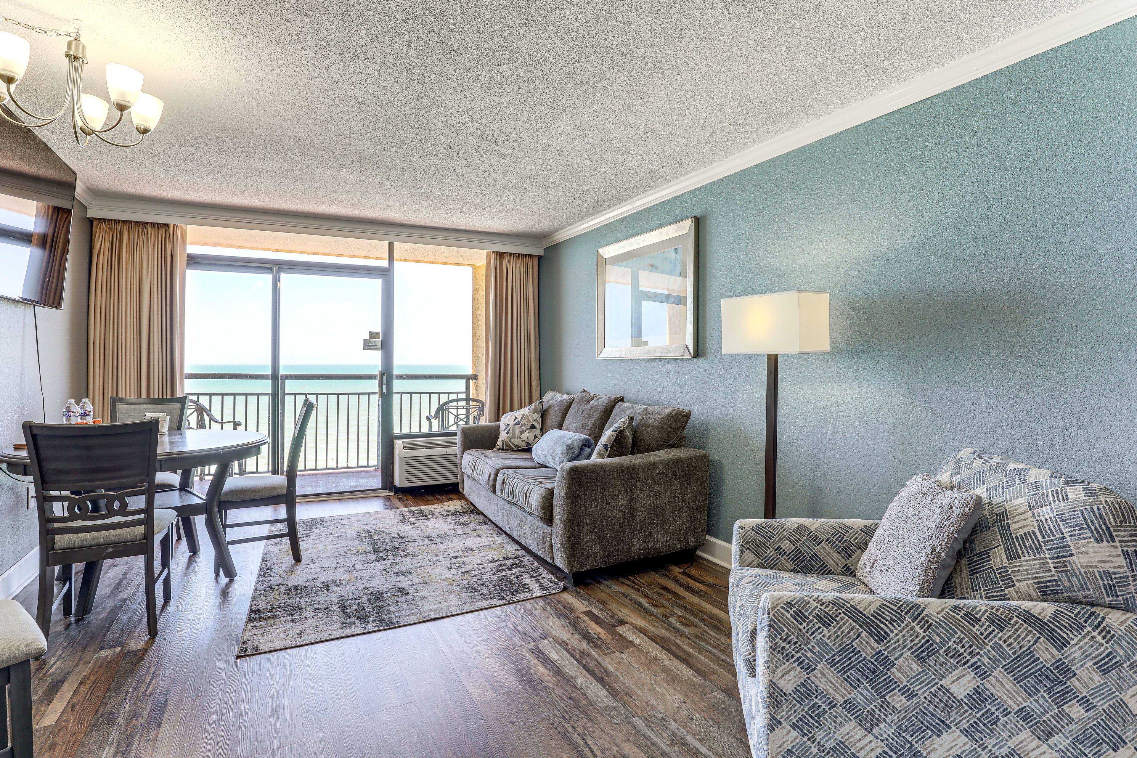 Living Room | Free WiFi | Flat-Screen TV | Window A/C Unit | Queen Sleeper Sofa