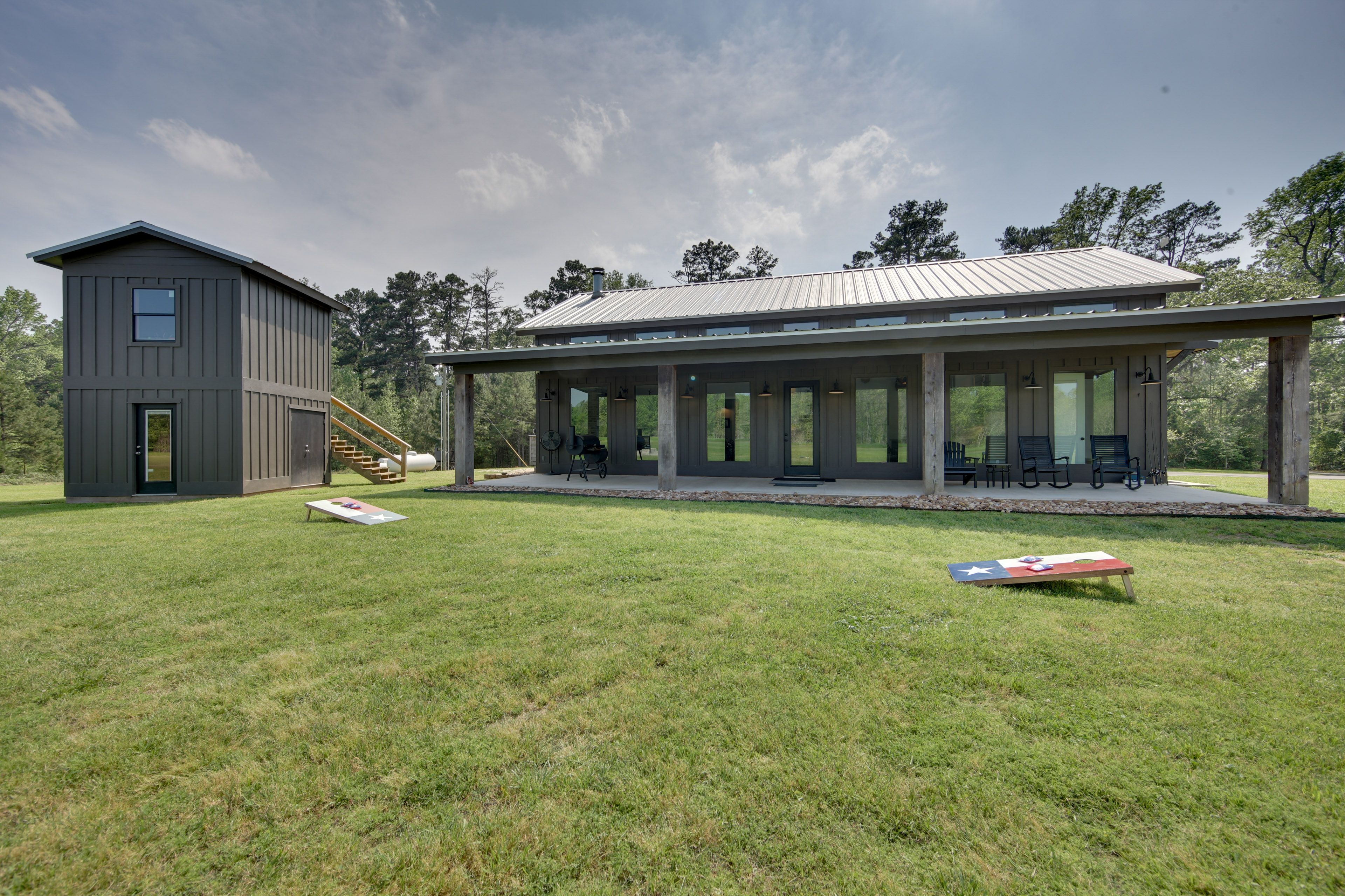 Cabin Exterior | Porch w/ Rocking Chairs | Charcoal Grill | Cornhole | Fire Pit