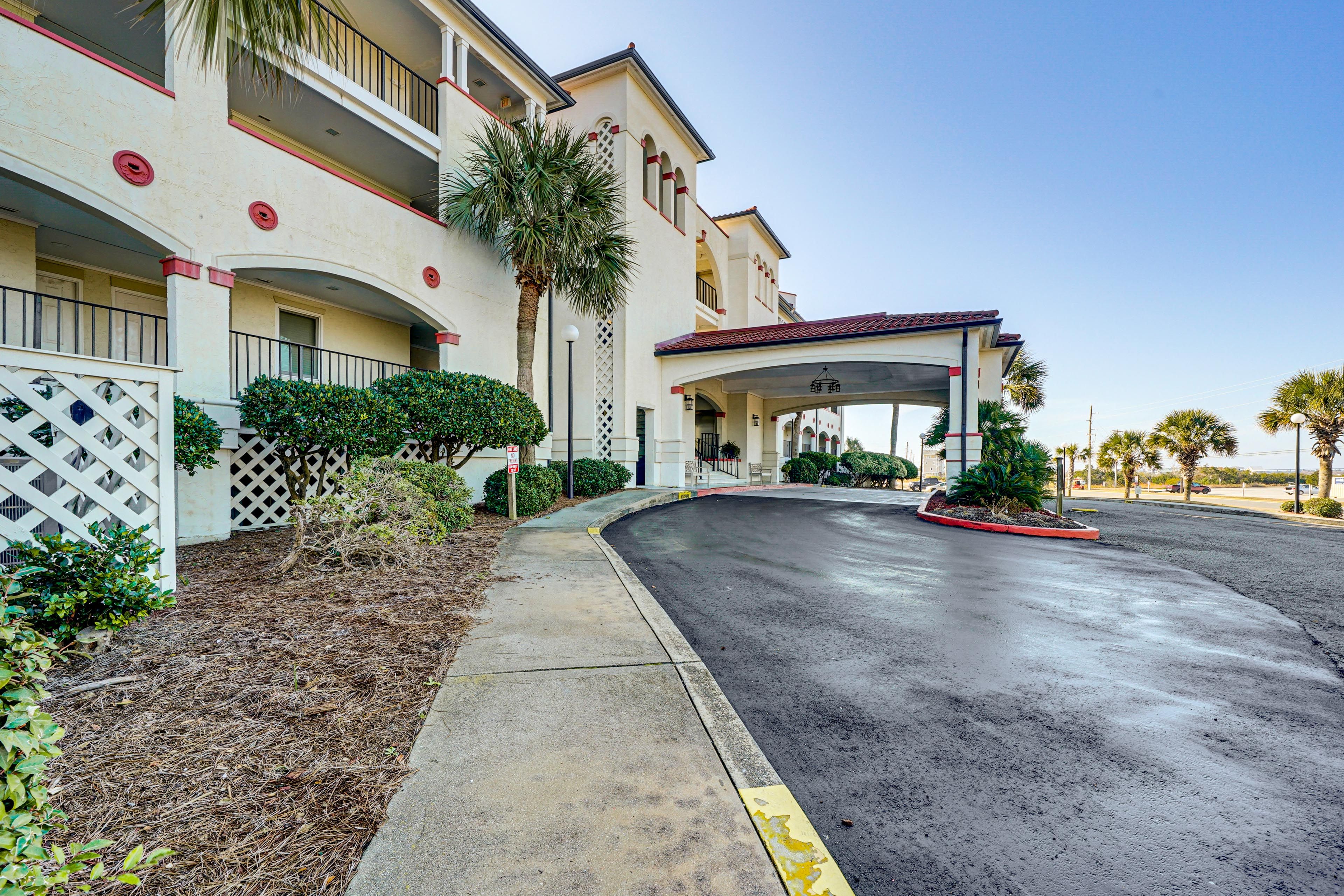 Condo Exterior | Parking | Community Lot (1 Vehicle, Parking Pass Included)