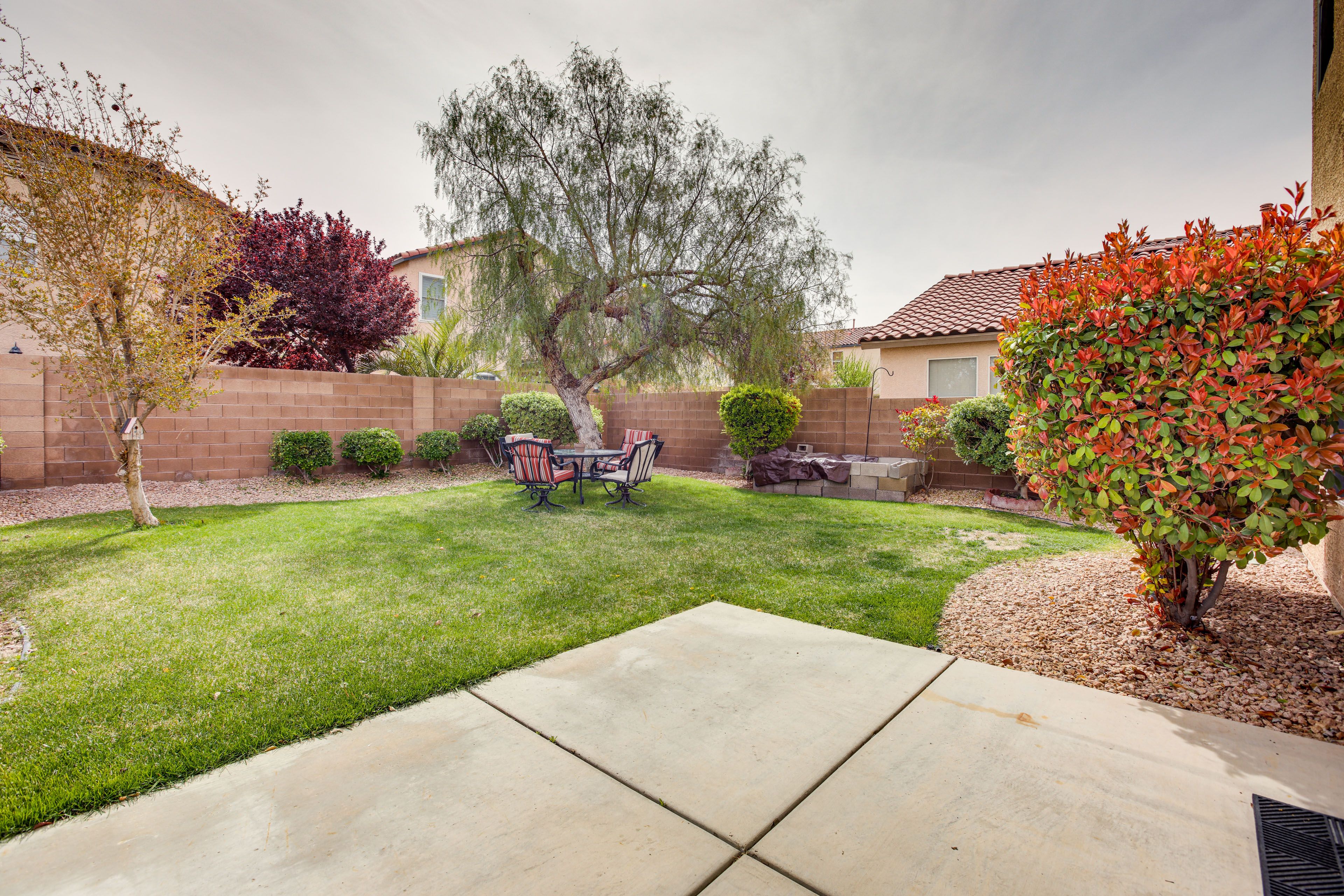 Fenced-In Yard | Dining Area | Charcoal Grill