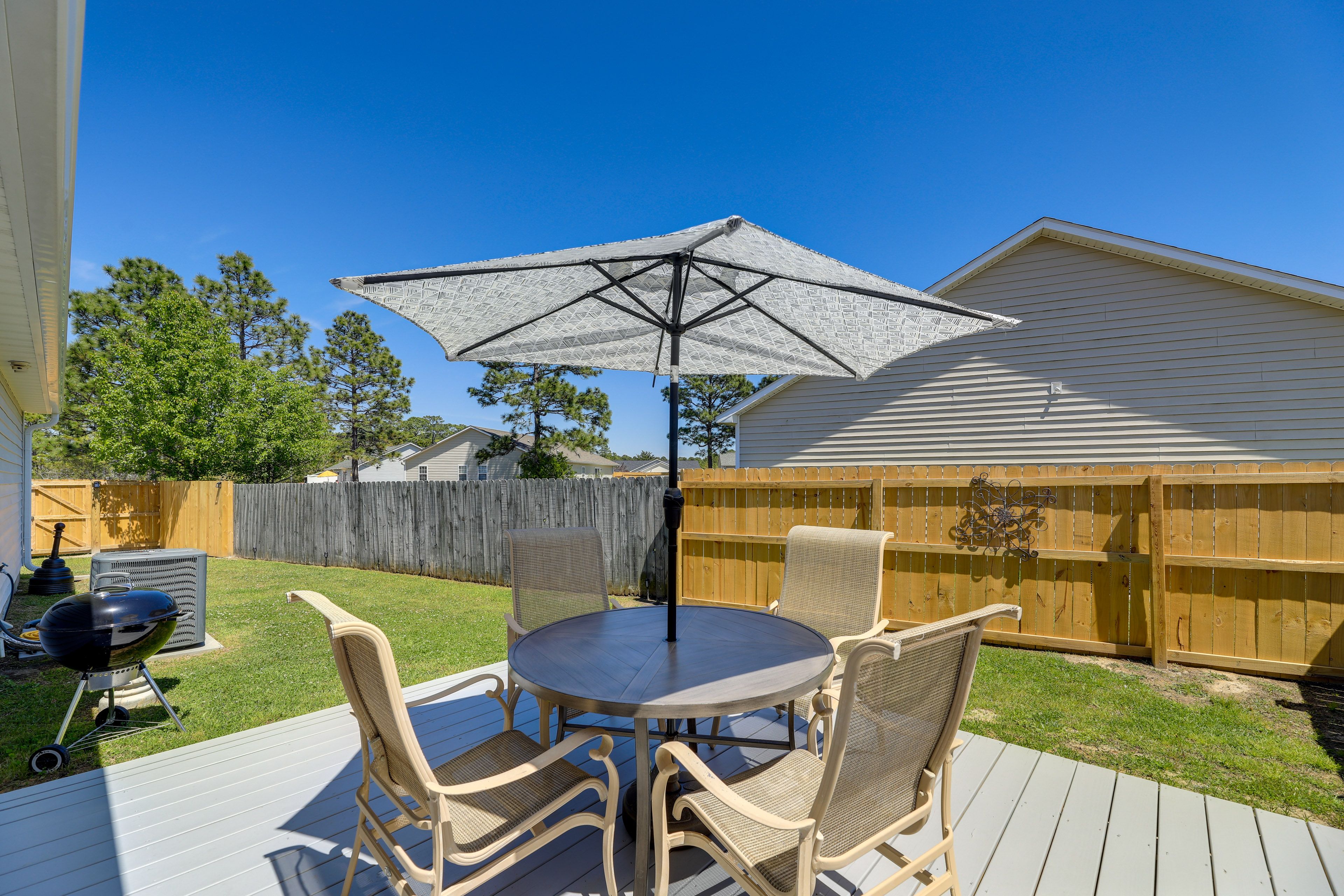 Townhome Exterior | Deck | Seating & Dining | Charcoal Grill