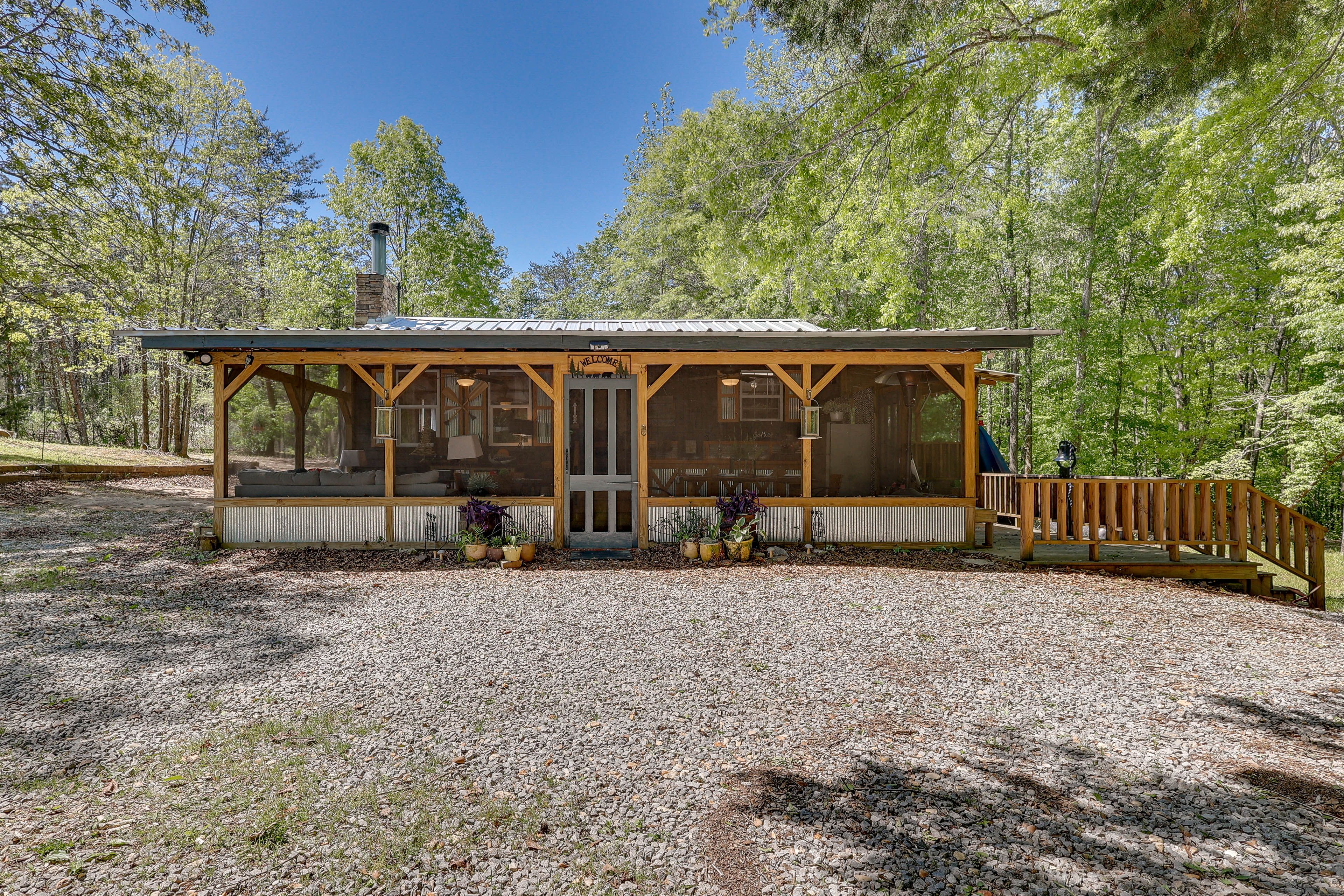Cabin Exterior | Family Friendly | Fire Pit w/ Grill Grate | Expansive Deck