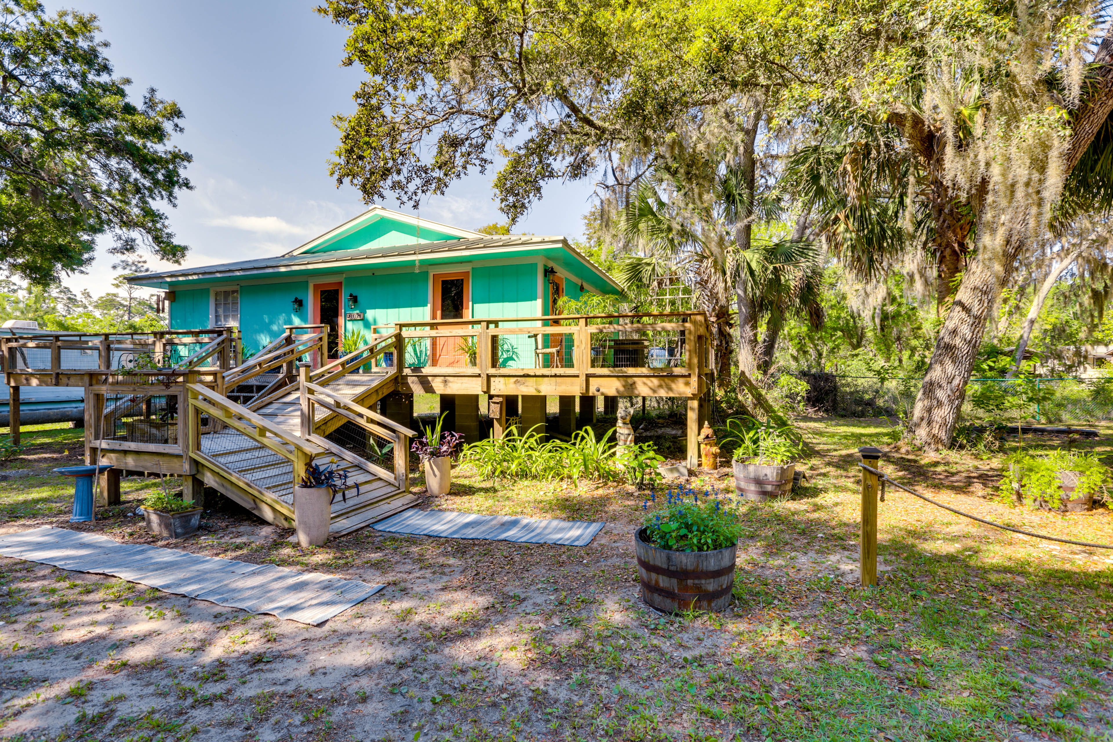Cottage Exterior | Grass/Dirt Driveway Parking (4 Vehicles)