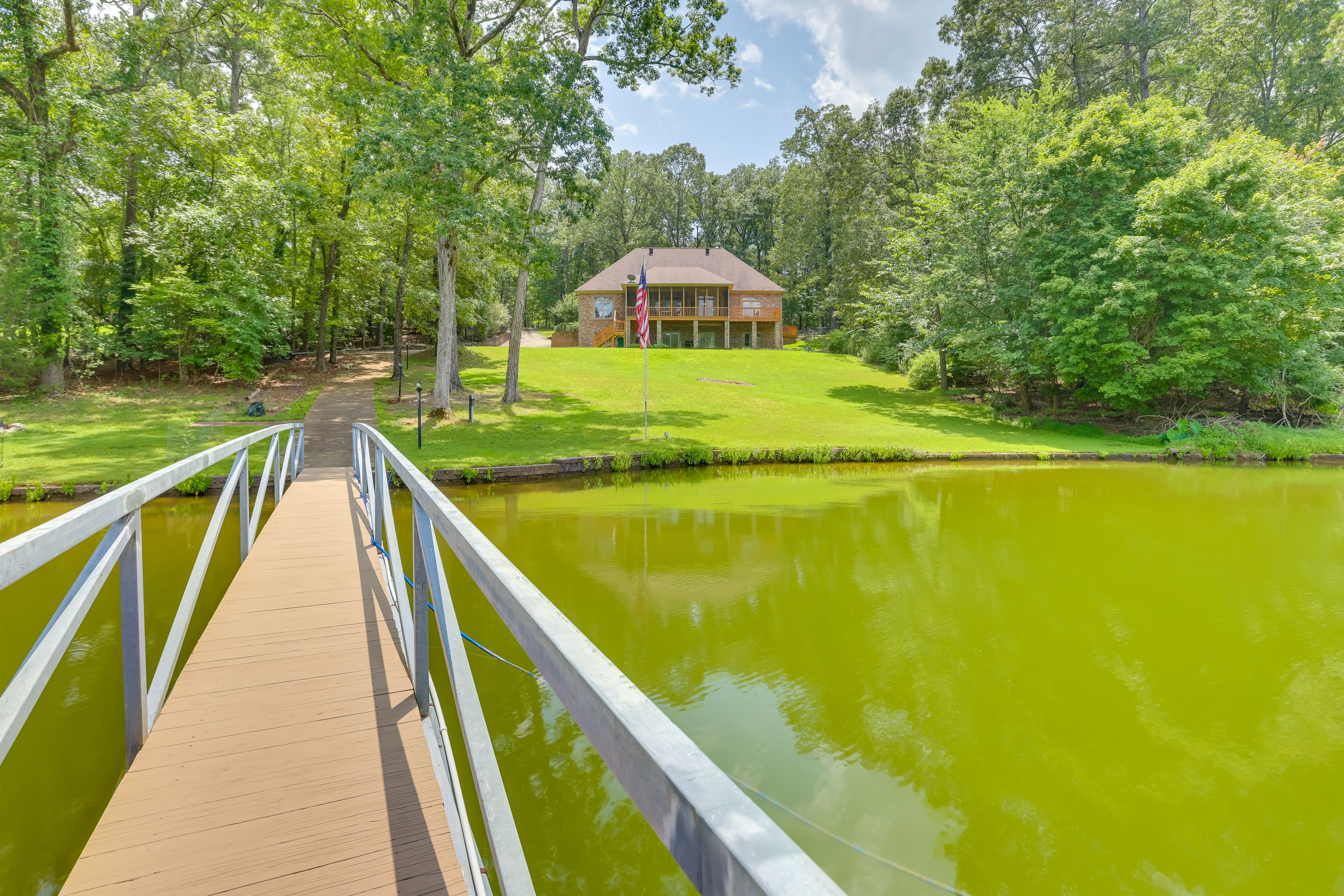 Shared Boat Dock | Waterfront Backyard | Additional Vacation Rentals On-Site