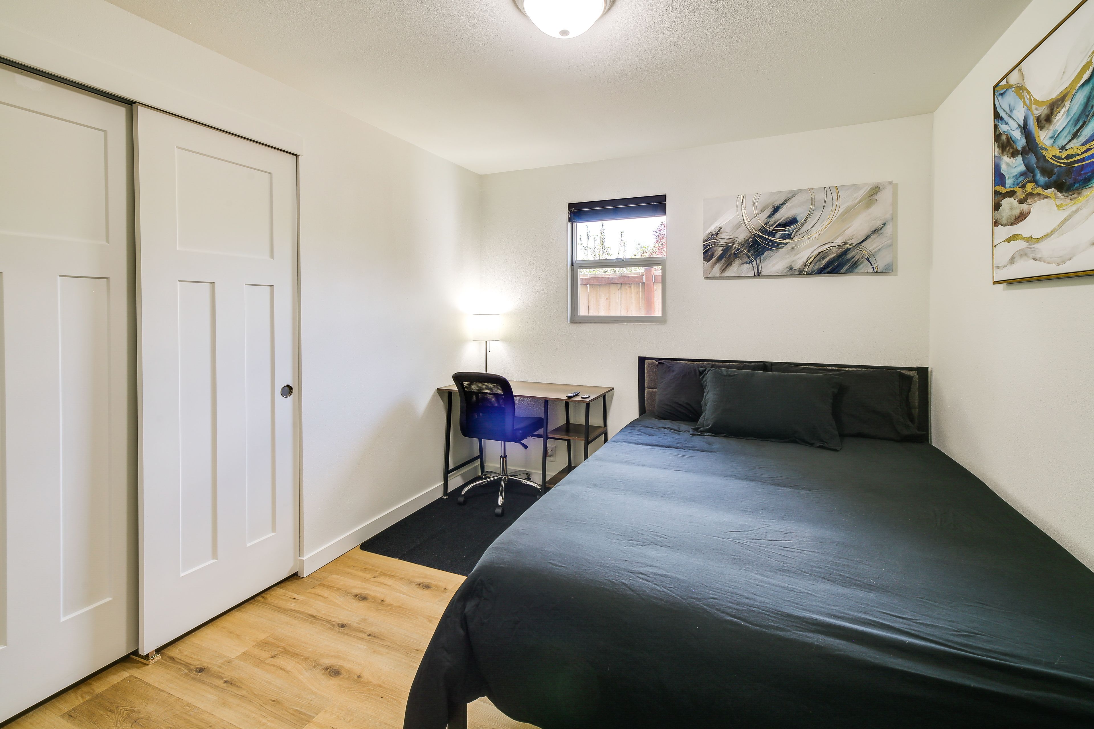 Bedroom 1 | Queen Bed | Smart TV | Dedicated Workspace | Tower Fan