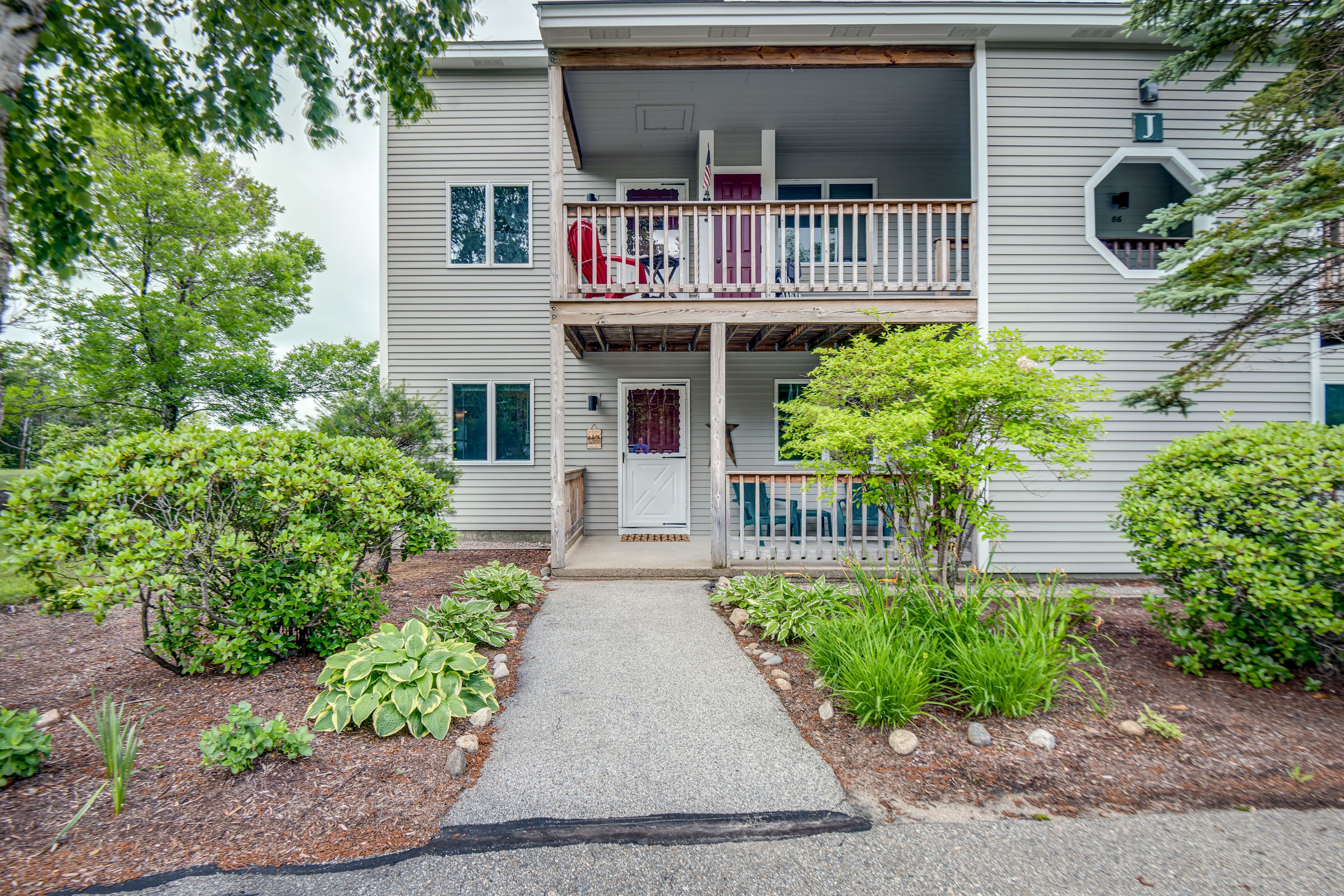 Condo Exterior | Community Lot (2 Vehicles) | Trailer Allowed (Overflow Lot)