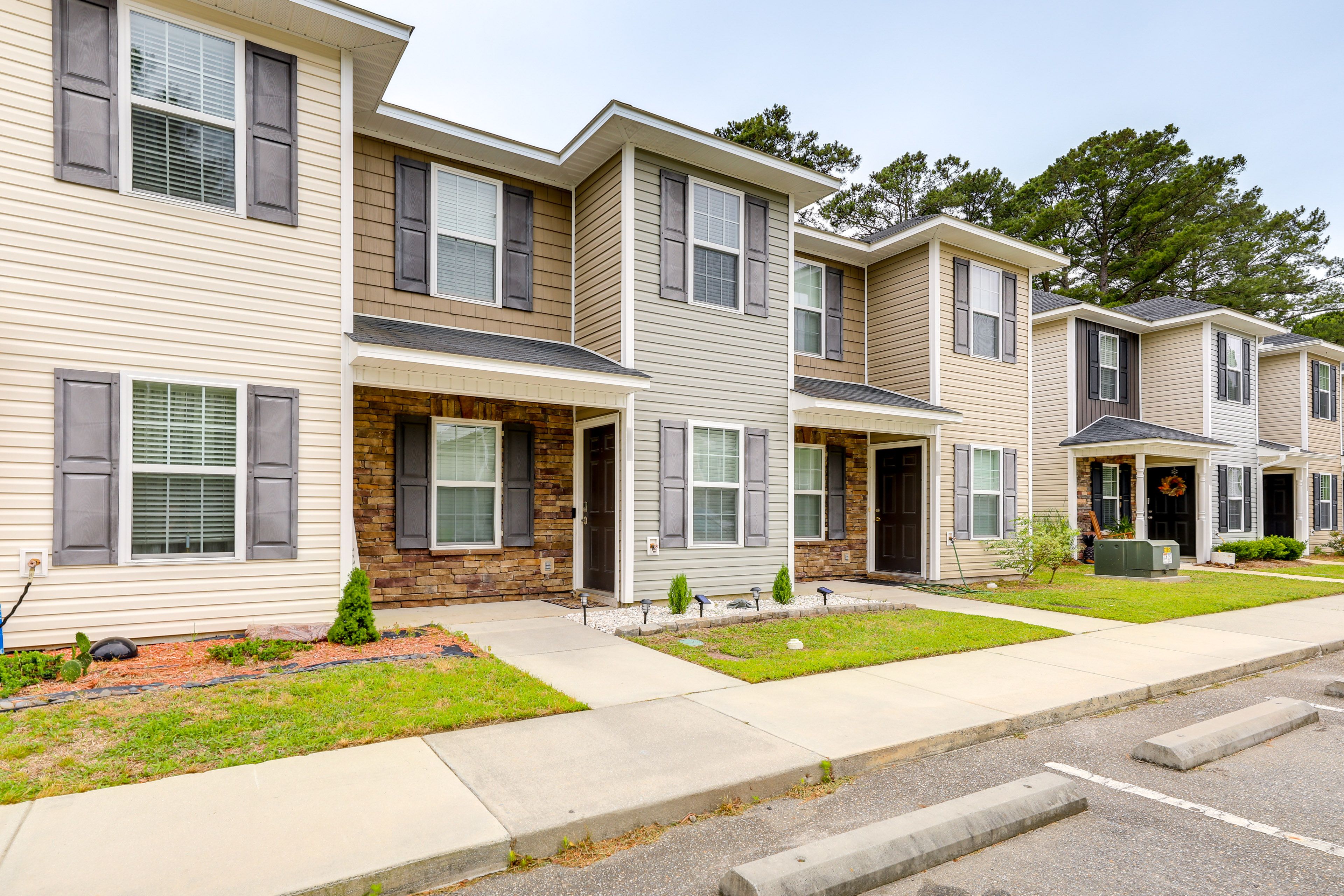 Townhome Exterior | Fenced-In Backyard
