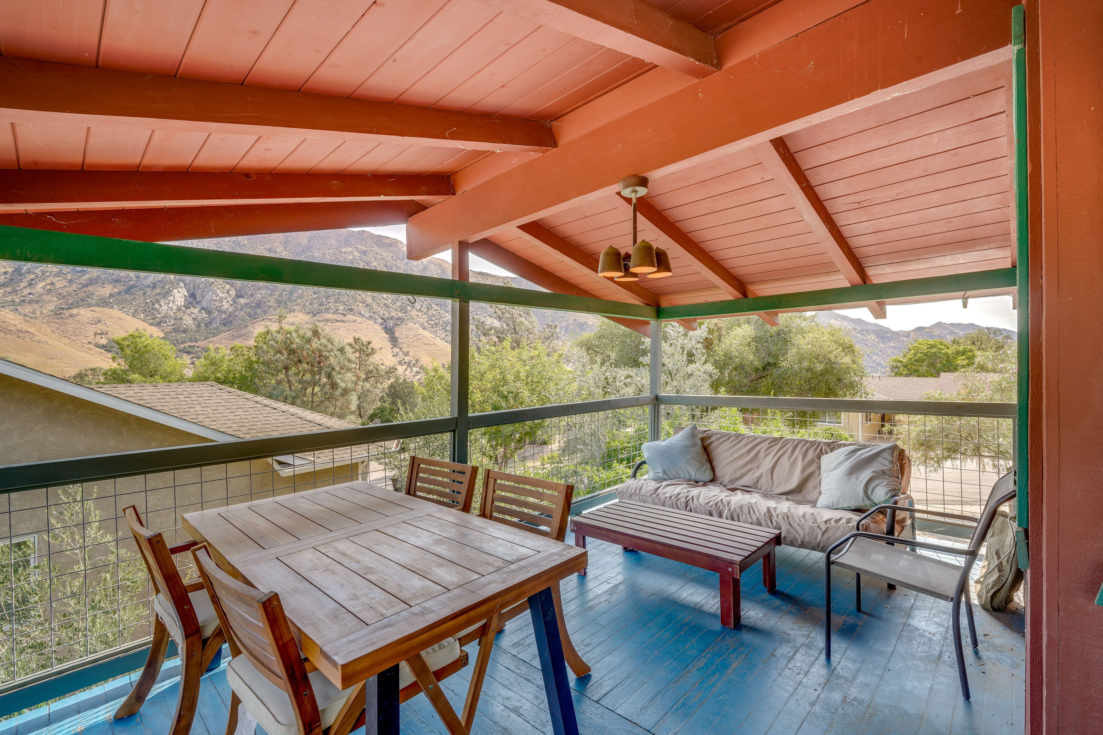 Wraparound Deck | Mountain Views | Covered Dining Area