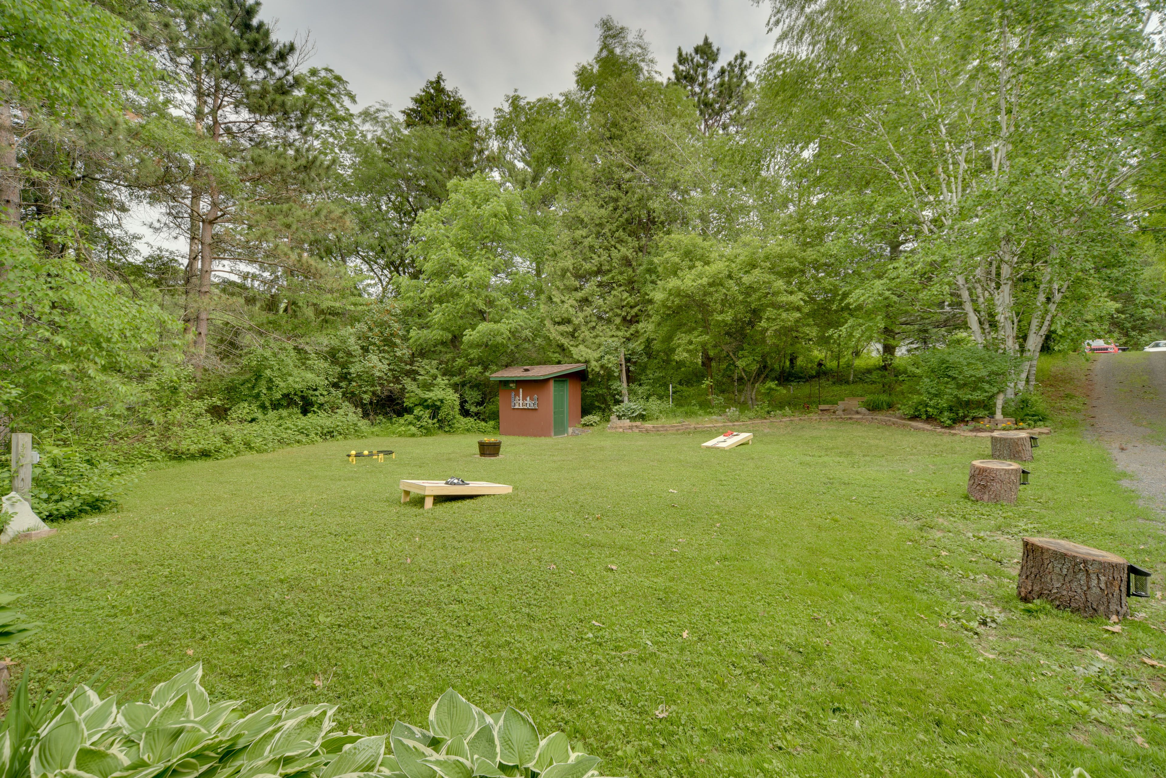 Cabin Exterior | Cornhole | Private Yard | Dog Friendly w/ Fee