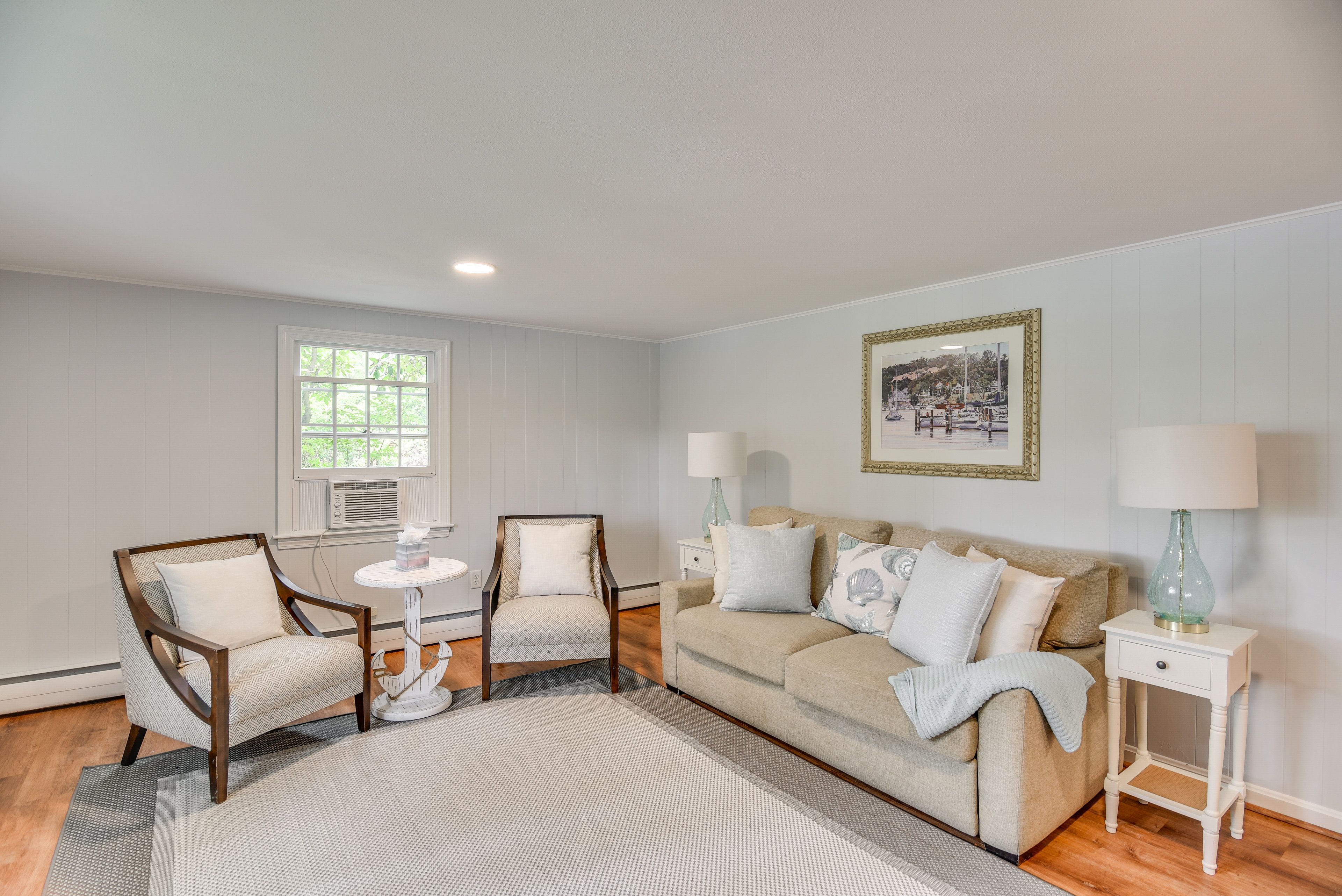 Family Room | Lower Level | Decorative Fireplace | Window A/C Unit
