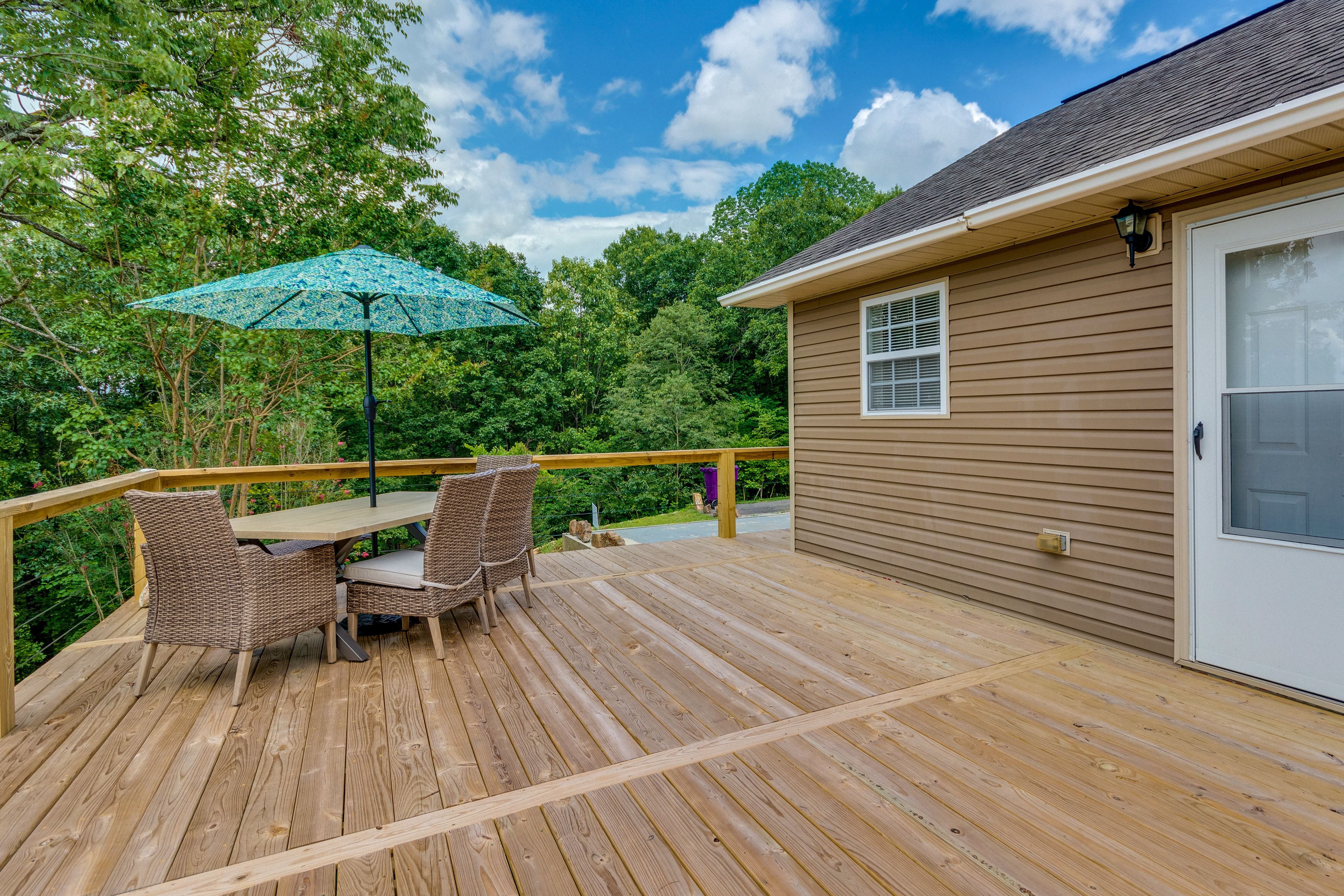 Cabin Exterior | Furnished Deck | Dining Area | Gas Grill | Lake/Mountain Views