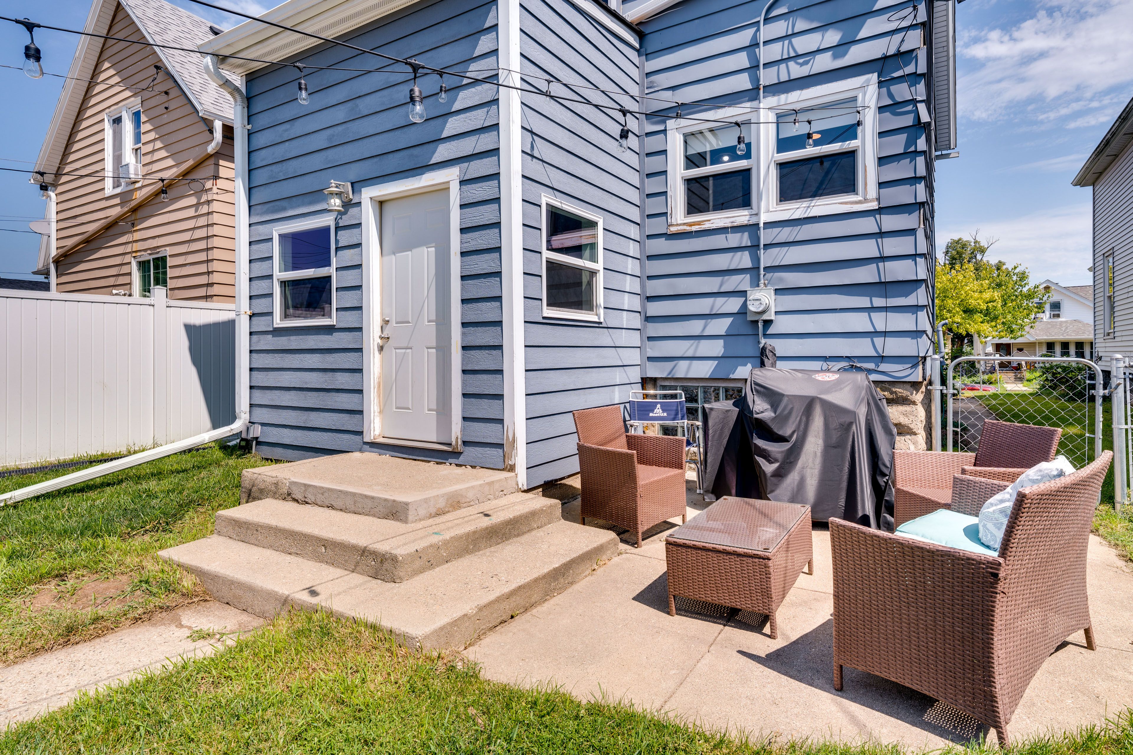 Fenced Backyard | Patio w/ Lounge Seating | Charcoal Grill | String Lights